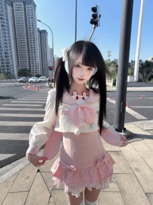 Detachable long-sleeve sailor collar blouse with bunny ear neckline decoration and removable polka-dot bow, ruffle hem pink skirt, side profile on city crosswalk with twin-tailed model