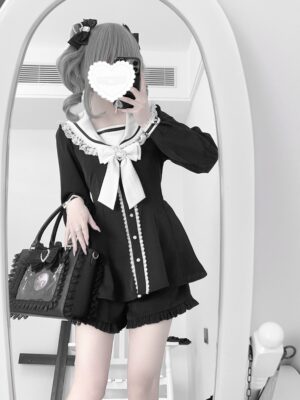 Jirai Kei black and white sailor collar dress with bunny-ear bow and ruffled shorts, mirror selfie casual indoor styling