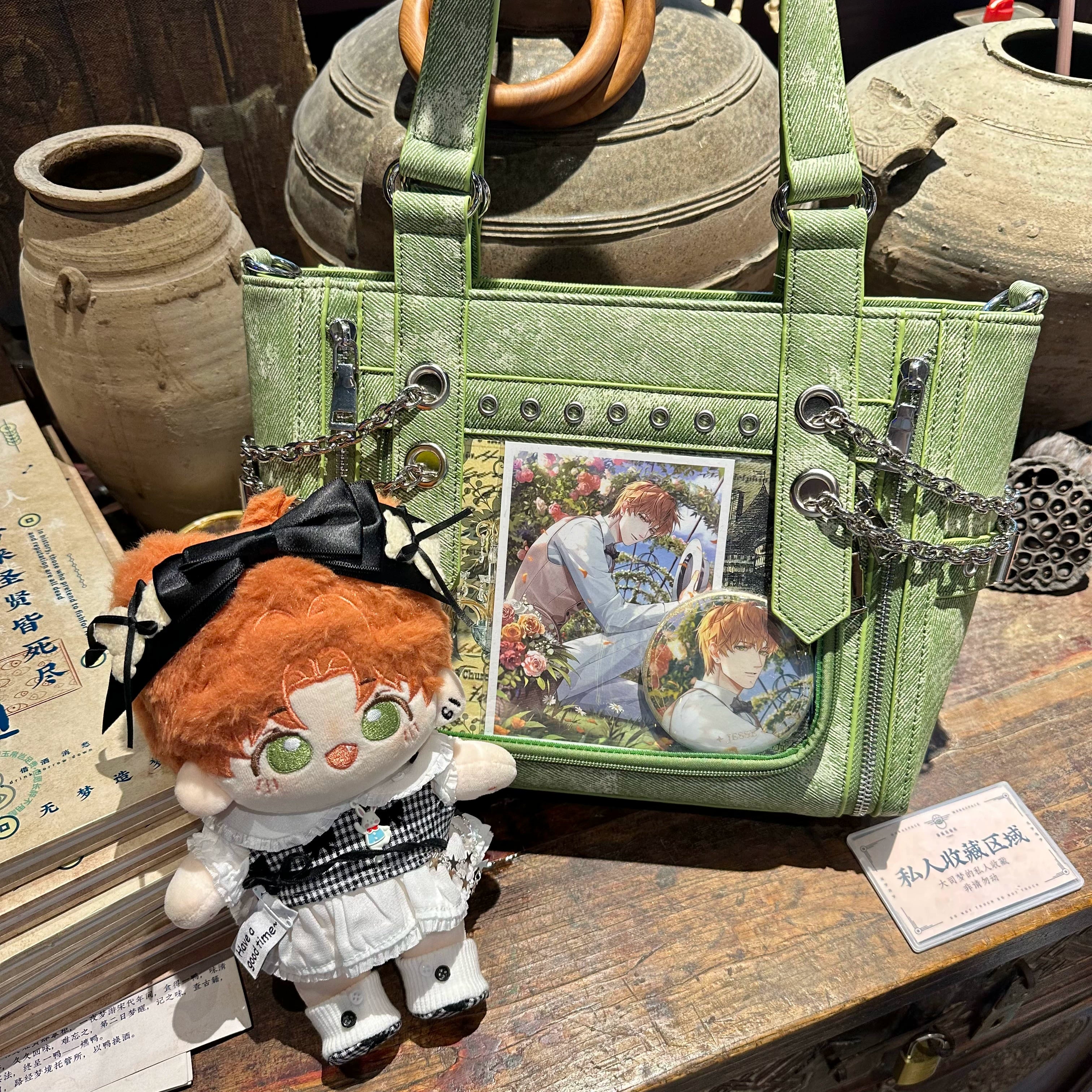 Sage green denim Jirai Kei ita bag with anime photo display inserts paired with plush doll rivet and chain trims