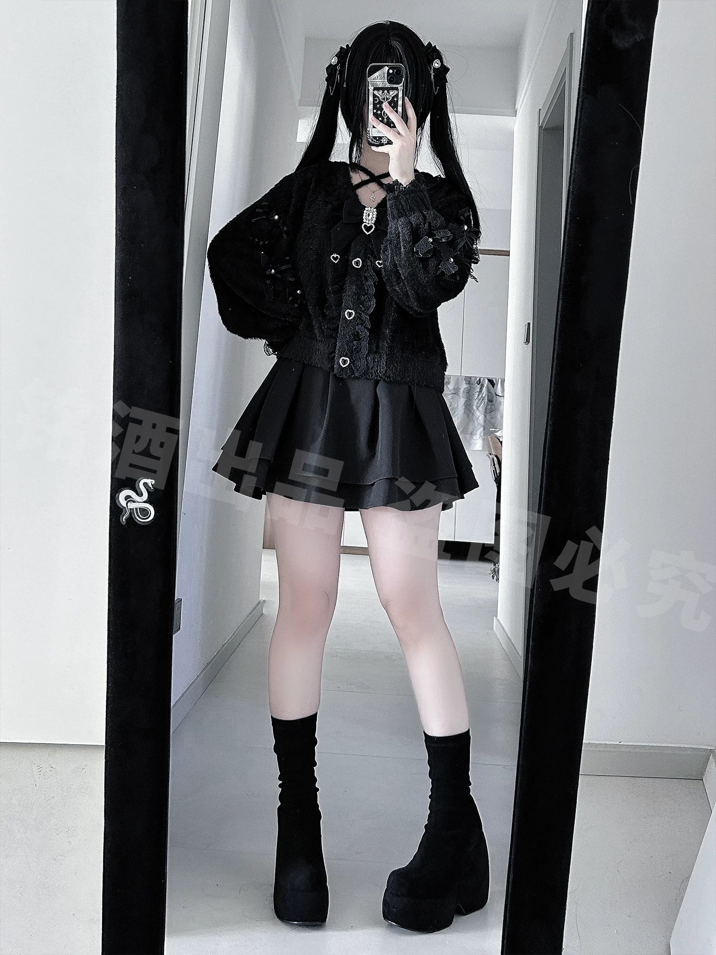 Full-body mirror selfie Jirai Kei outfit black fuzzy cardigan pleated mini skirt twin ponytails black boots