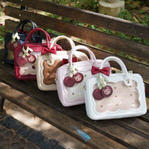 Multiple cherry bear cookie Jirai Kei bags in assorted colors including pink white wine red and black displayed on wooden bench outdoor setting overhead view