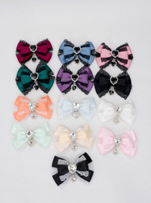 13-color jirai kei lace rhinestone bow hair clip collection flat lay overhead view multiple color variants