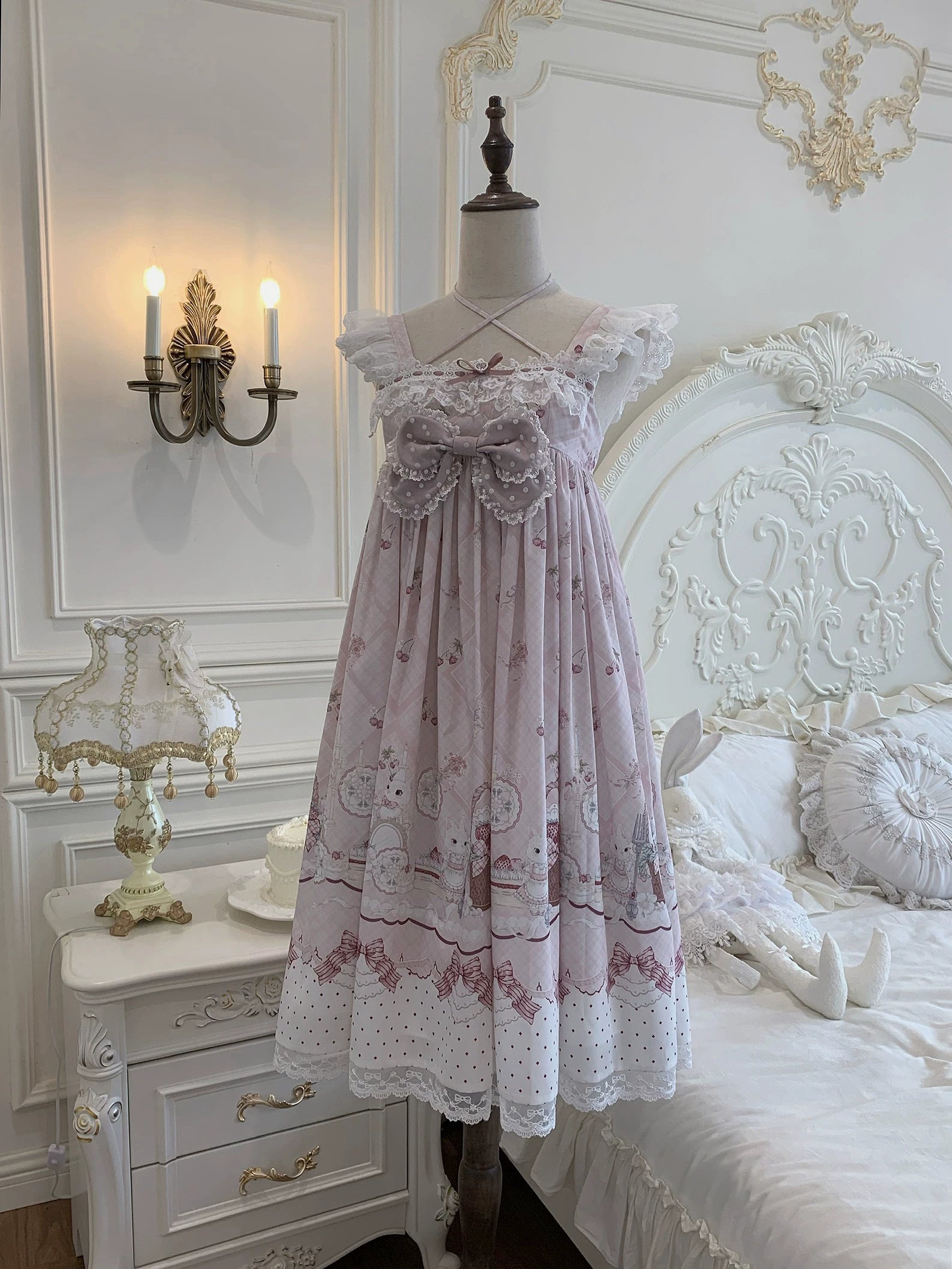Strawberry bunny Jirai Kei Lolita dress product photography showing complete garment with detachable chest bow halter neckline lace sleeves and plaid print details