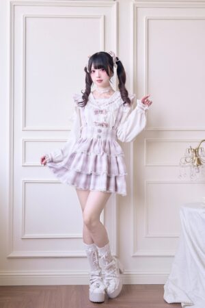 Pink plaid Jirai Kei dress set front full body view with tiered pink plaid skirt white platform boots studio photography