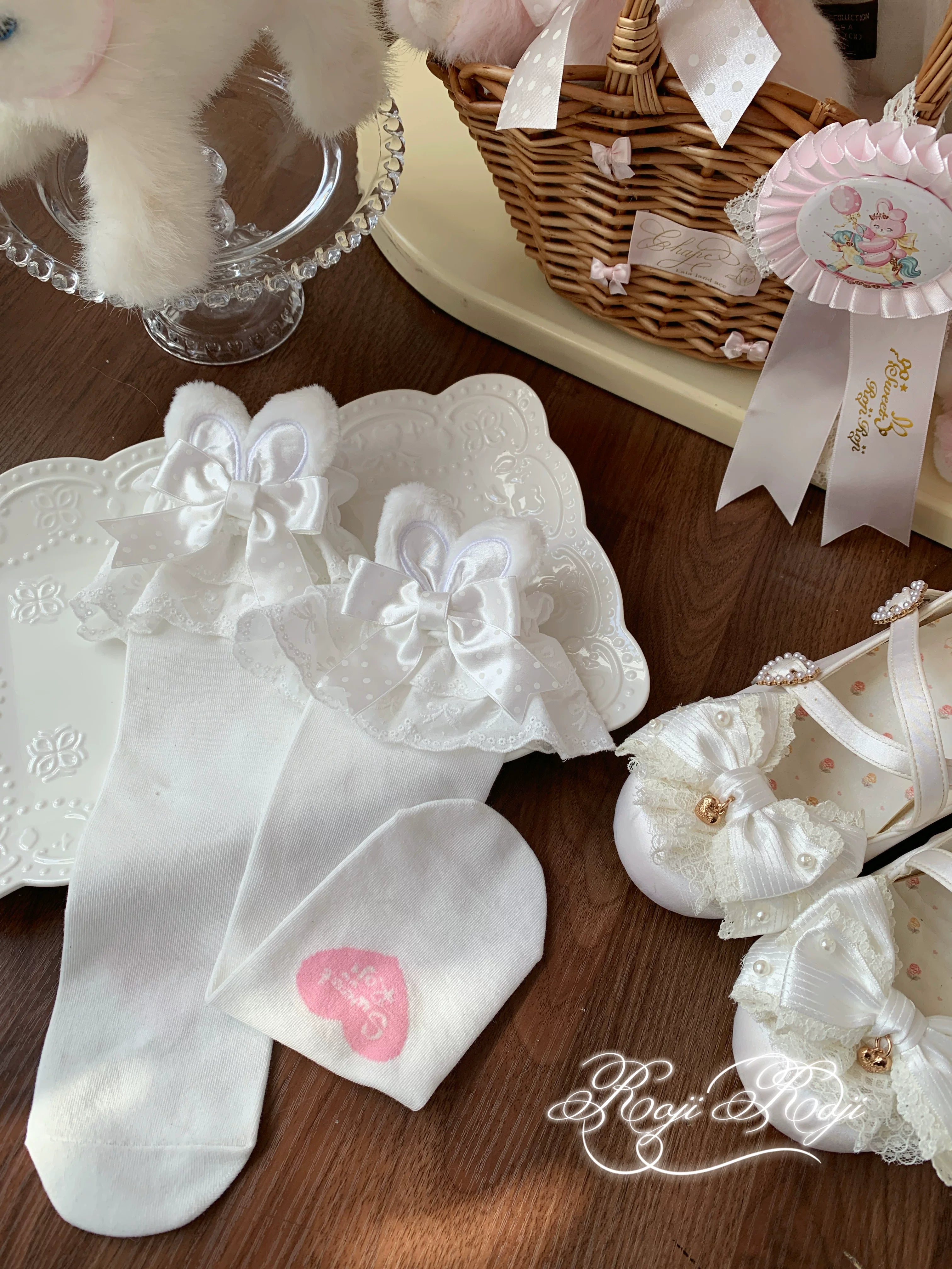 Jirai Kei brown polka dot bunny ear socks with white base worn with dark brown flat shoes and brown frilled polka dot Lolita skirt in specialty shop setting