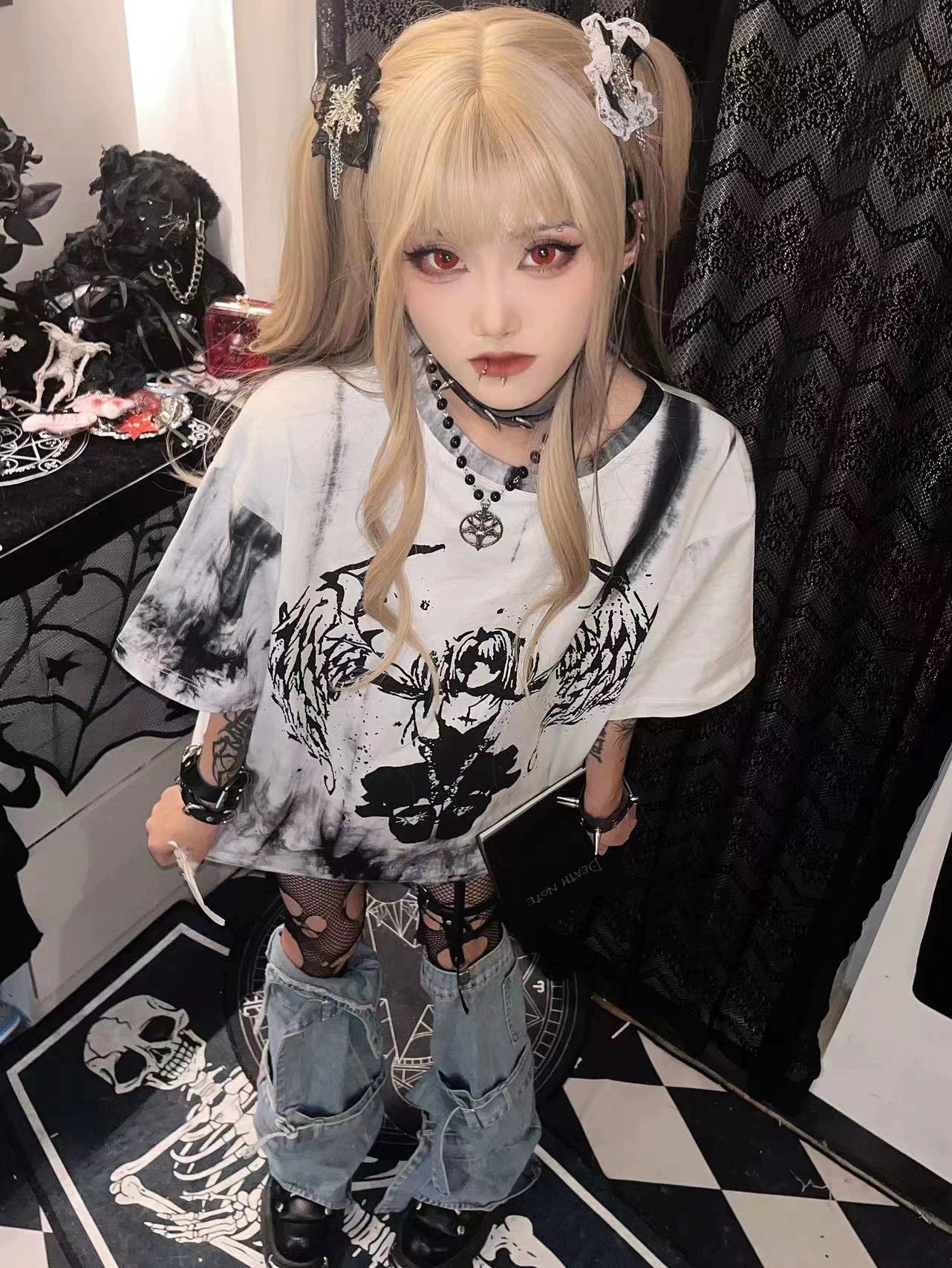 Close-up detail of celestial angel graphic print on tie-dye gothic jirai kei t-shirt showcasing dark artistic design and fabric quality