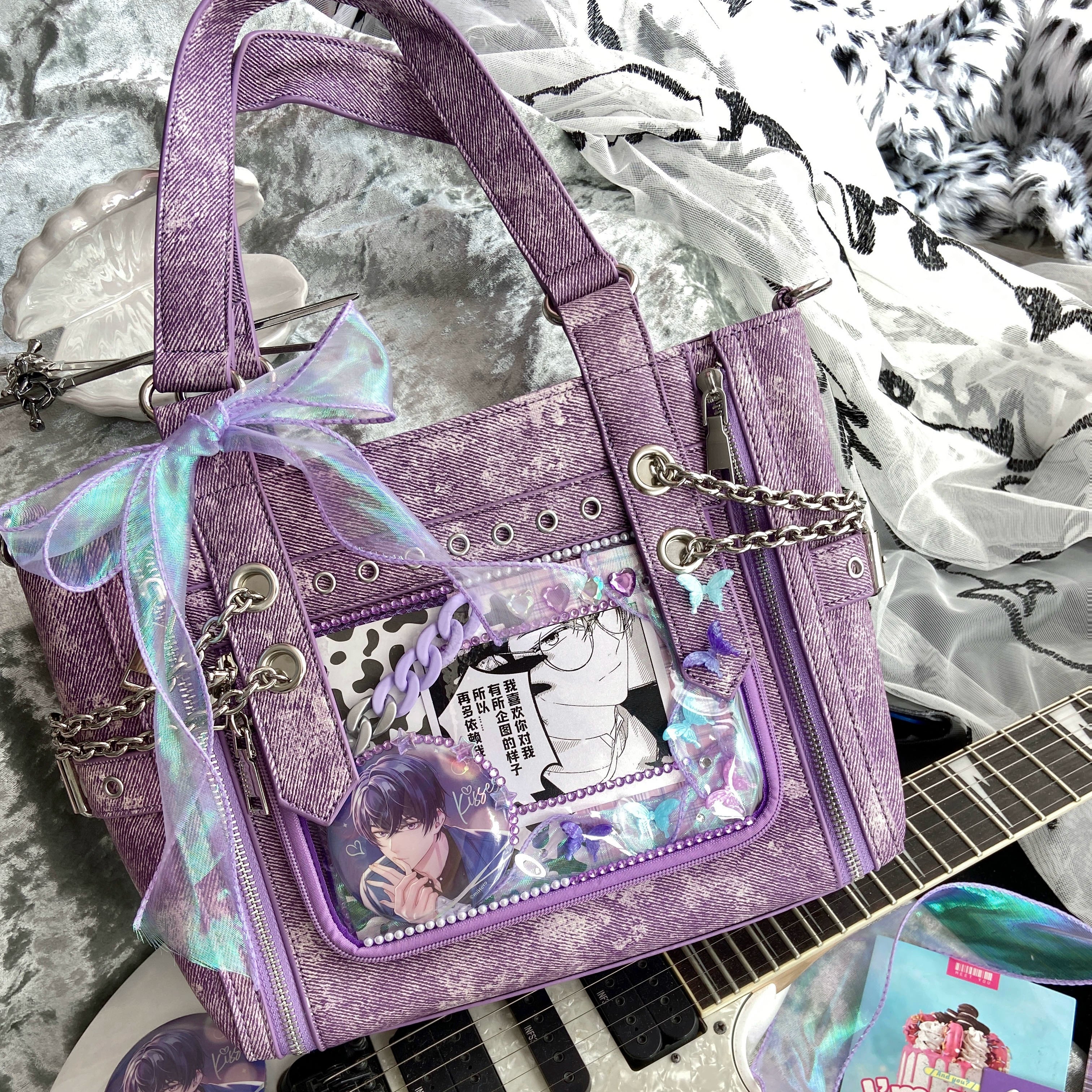 Purple washed canvas Jirai Kei ita bag with sheer ribbon bow anime display window and metal chain decorations