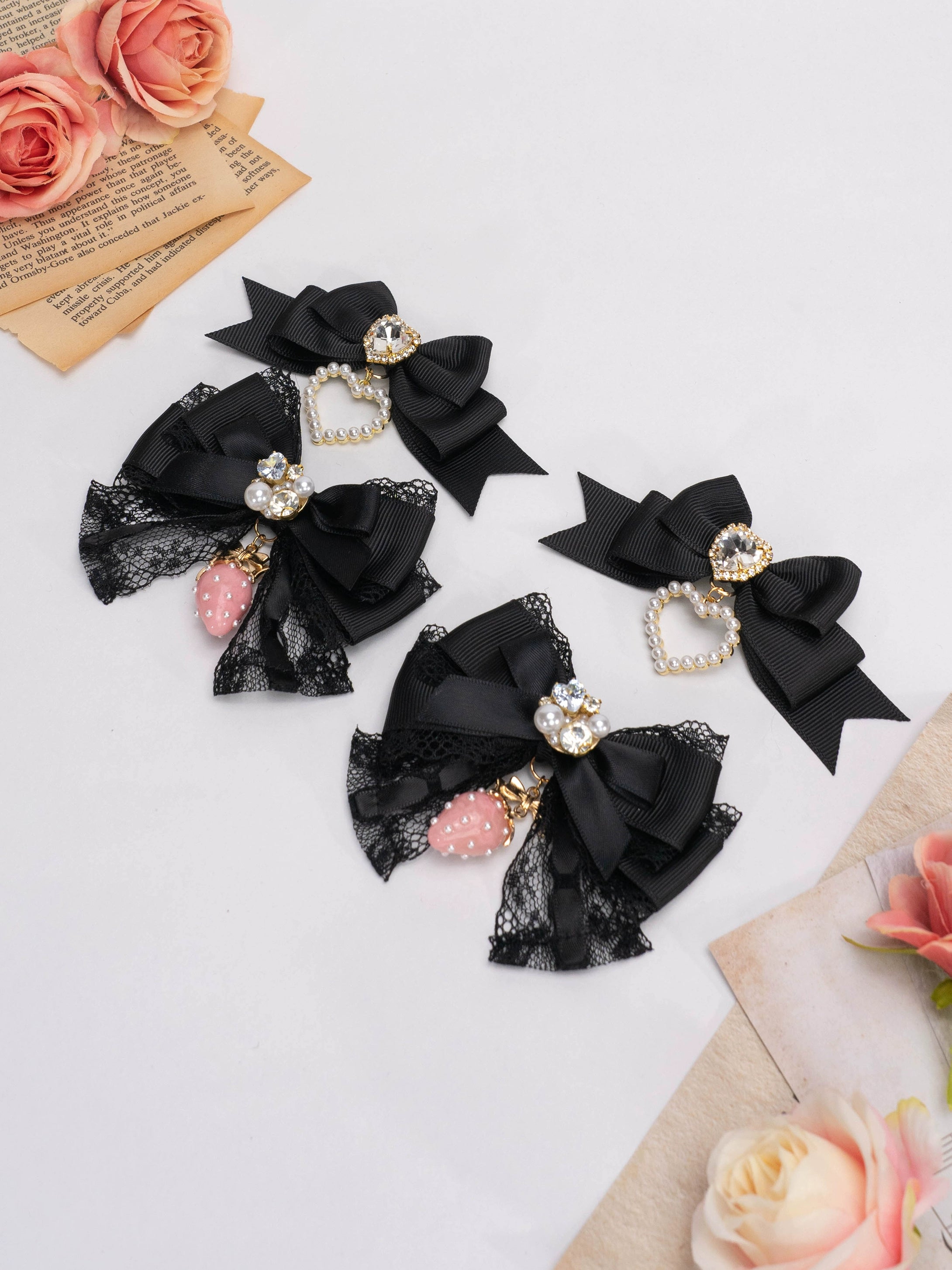 Black Jirai Kei lolita bow hair clips with lace strawberry charm and rhinestone heart details subculture style