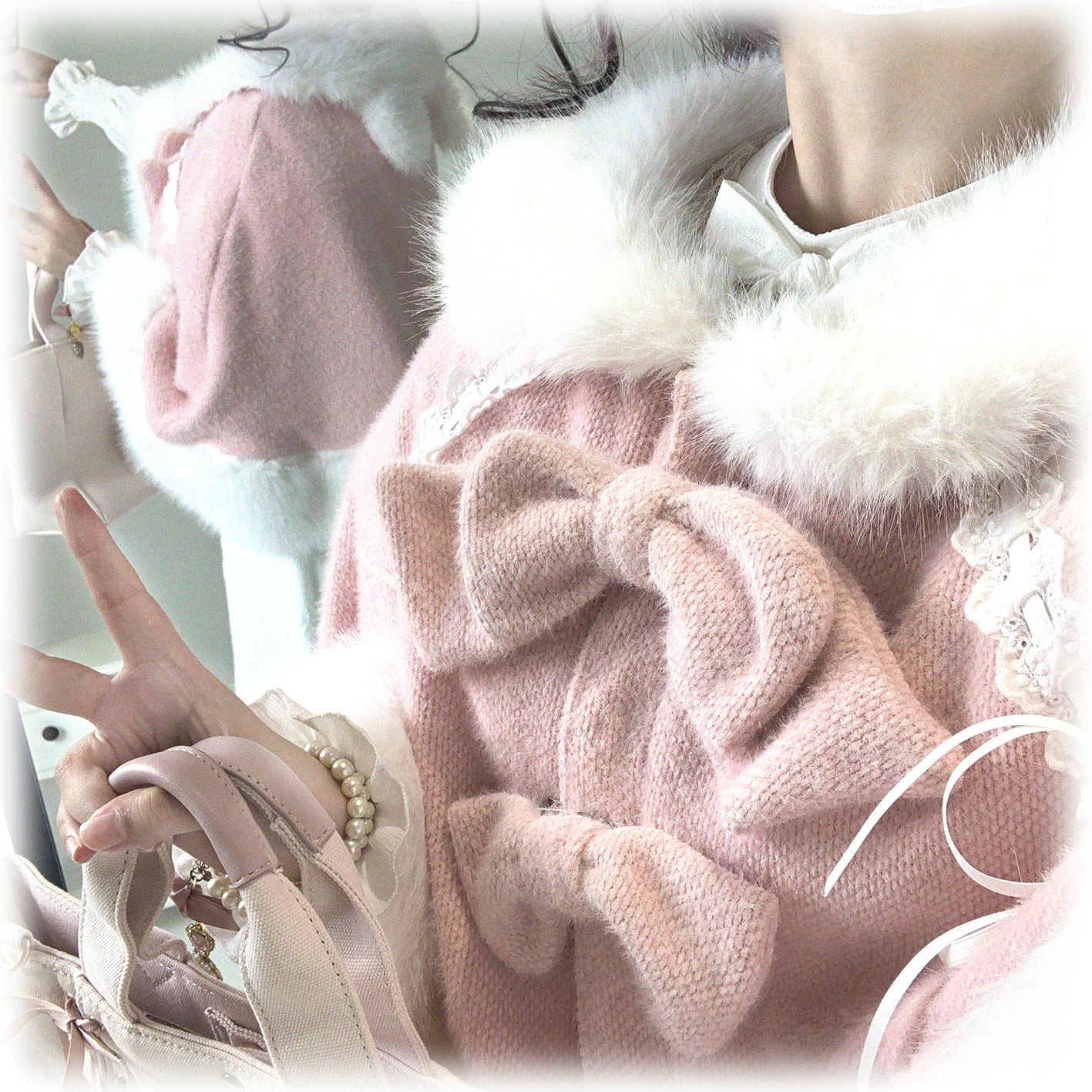 Close-up detail view of pink Jirai Kei bunny ear cape showing fluffy bows lace ribbon trim and premium faux fur trims