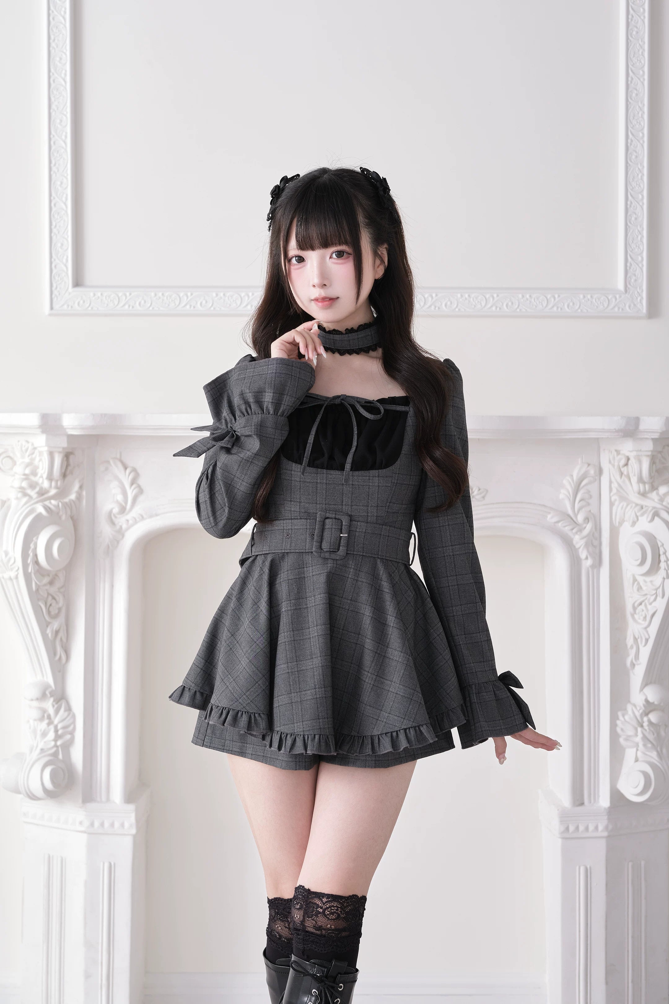 Dark gray plaid mini dress front three-quarter angle showing waist belt removable design and lace choker
