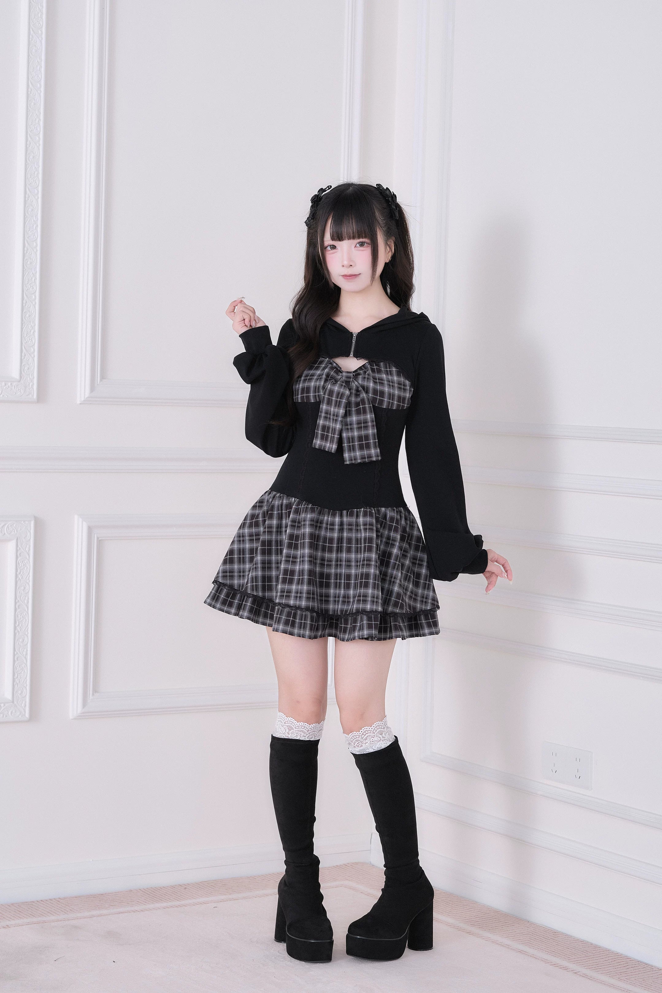 Plaid Jirai Kei hoodie one-piece dress front pose showing bow detail, ruffled skirt and knee-high black boots on model