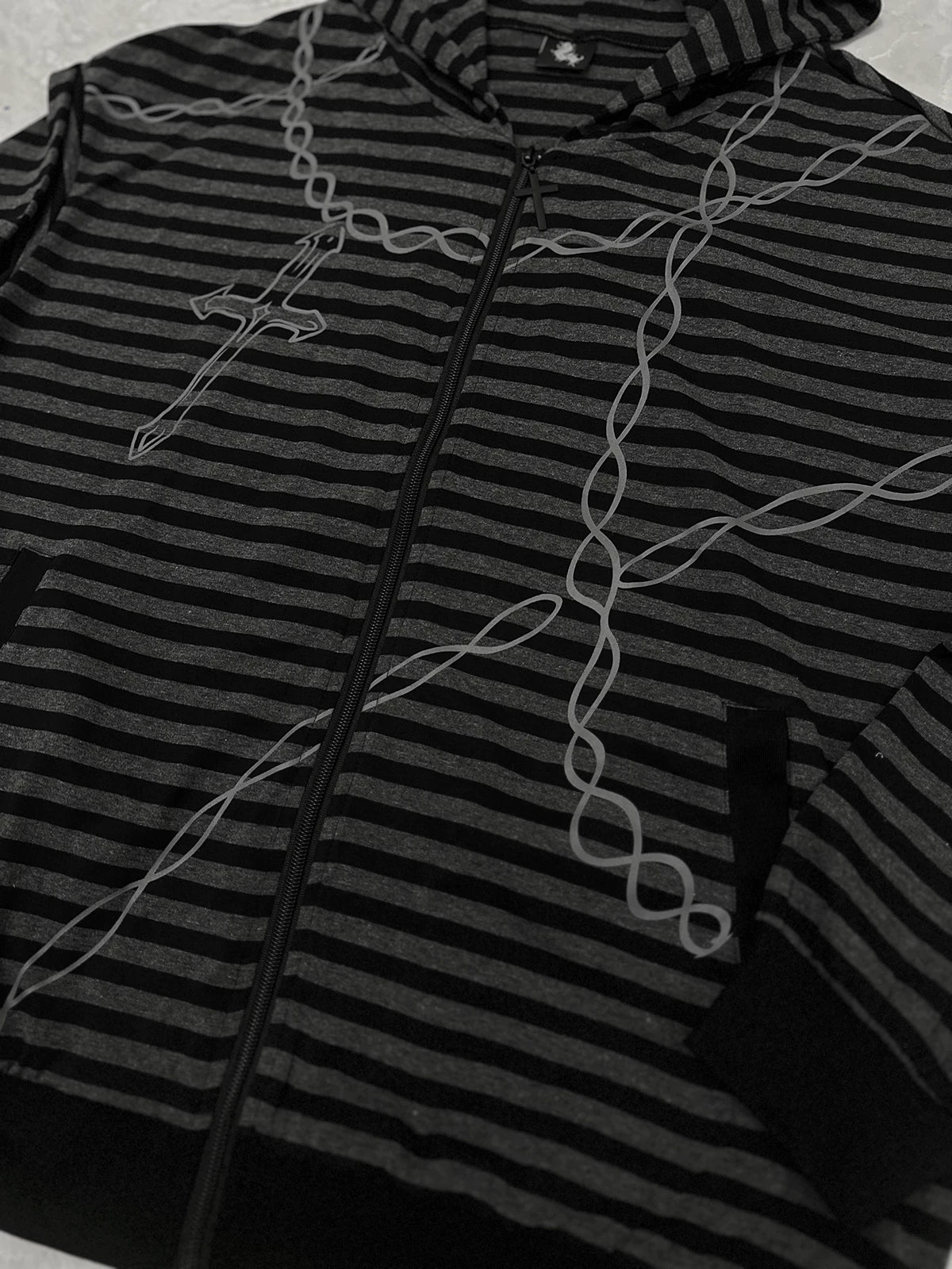 Jirai Kei hoodie front close-up view displaying full zip closure, stripe pattern, cross and chain motif prints