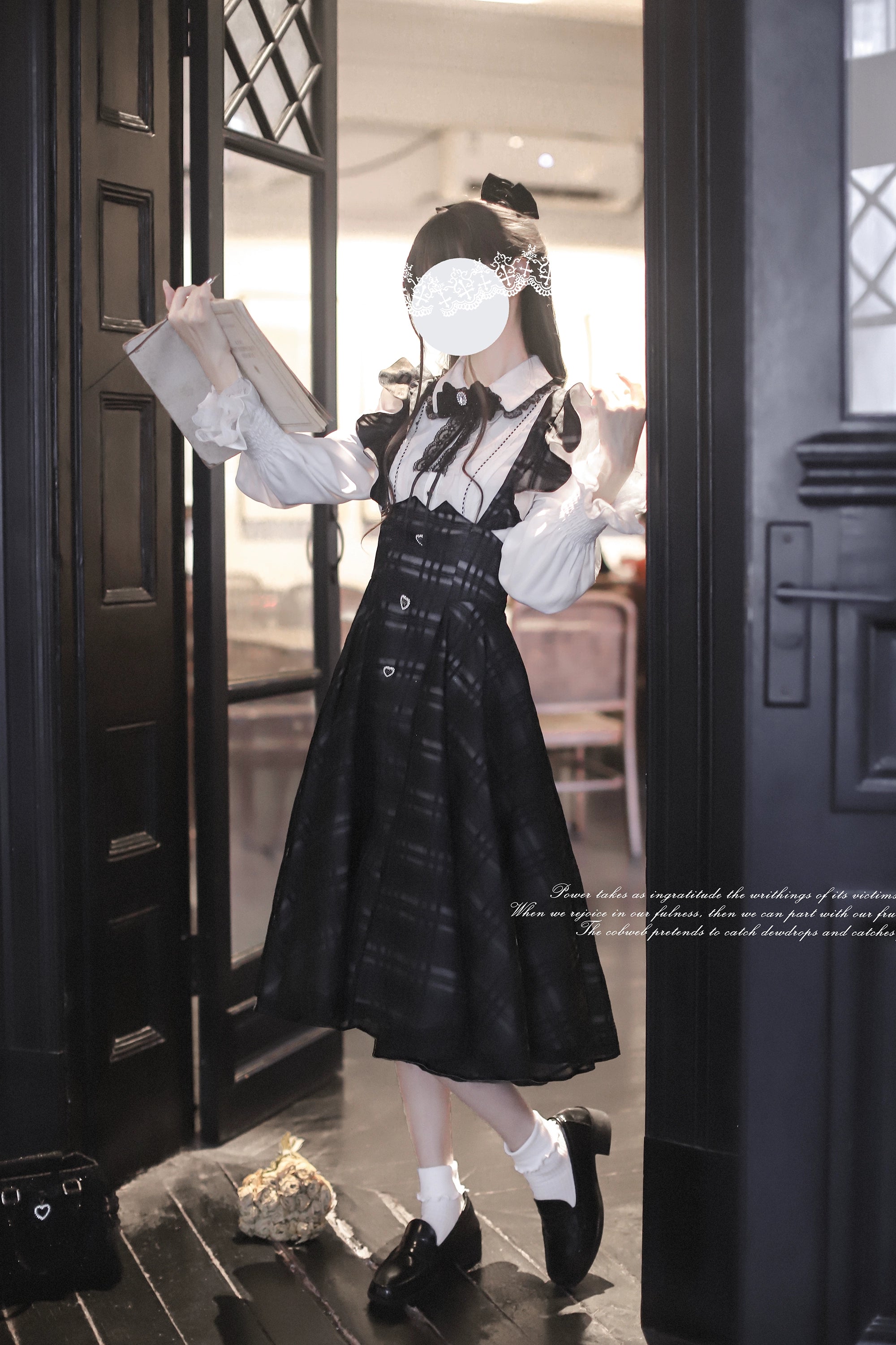 Seiso Kei suspender skirt outfit with ruffled shoulder straps and plaid pattern detail, model at vintage doorway holding book prop showing styling versatility