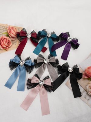 assorted jirai kei lace bow rhinestone hair clips multicolor collection flat lay overhead view black lace satin ribbon