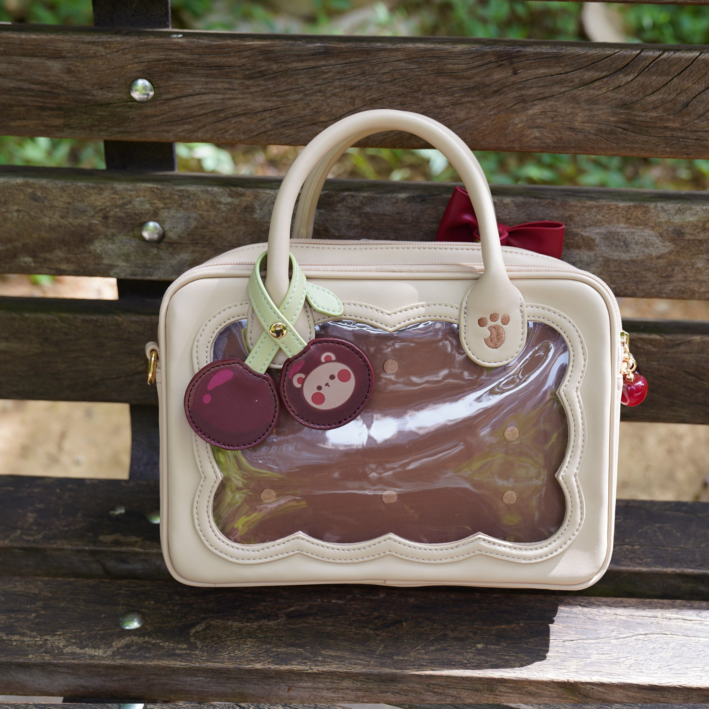 Warm beige biscuit colored cherry bear cookie Jirai Kei crossbody bag with brown polka dot acrylic panel and paw print hardware