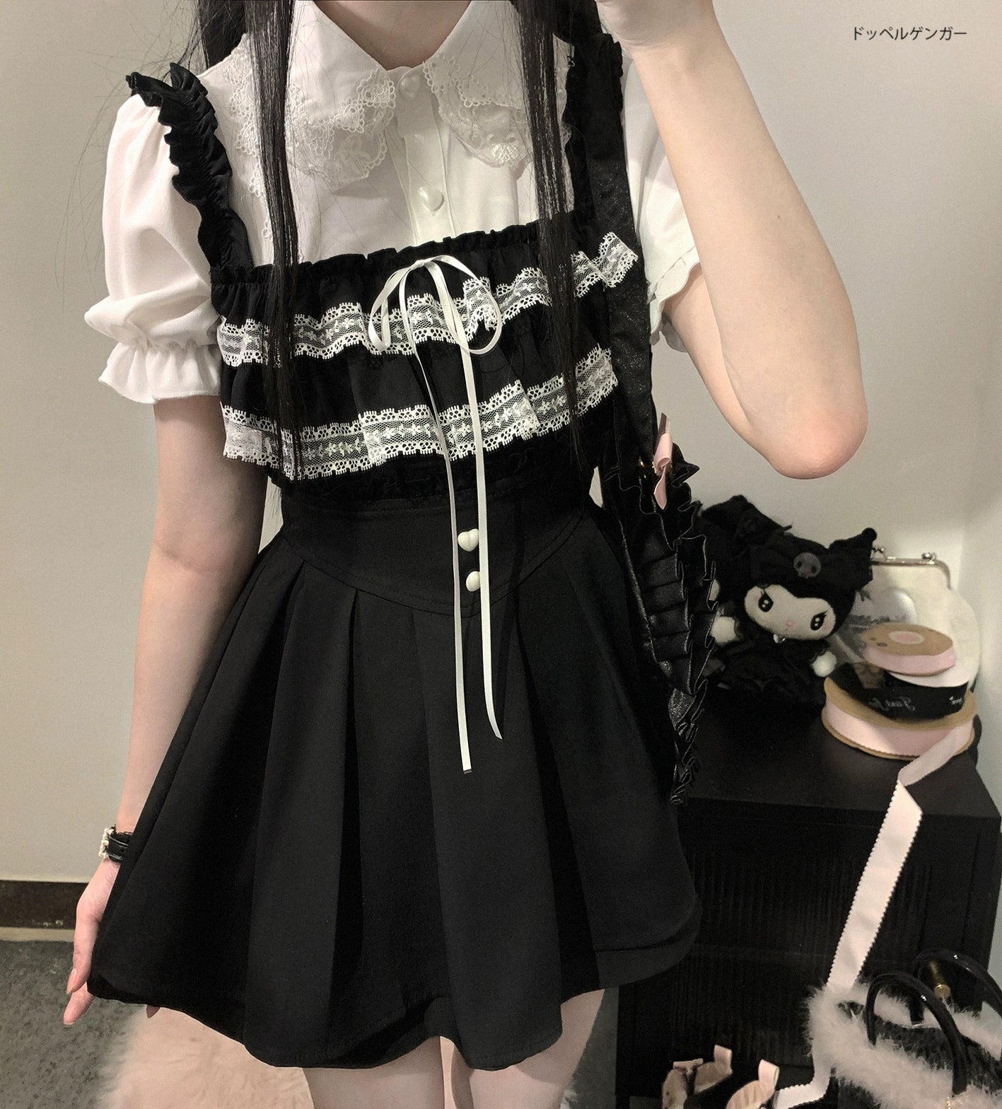 Black and white Jirai Kei chiffon blouse with ruffled lace collar, bust drawstring tie detail, close-up front mirror selfie view, heart-shaped buttons visible