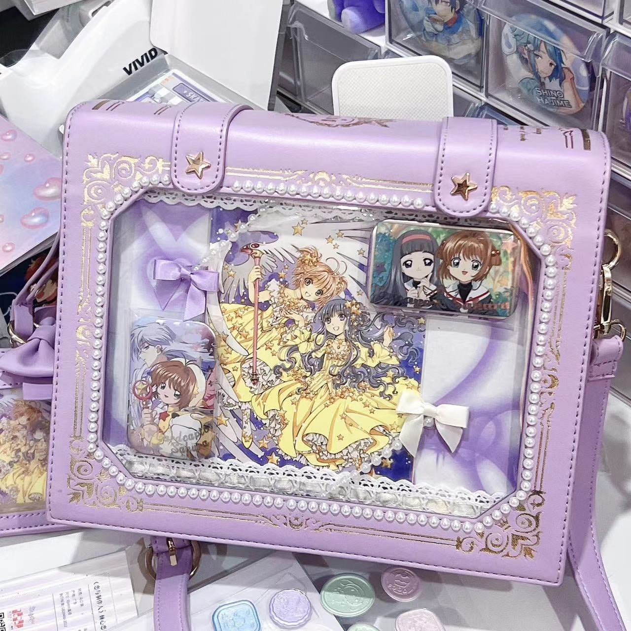 Purple vintage grimoire Jirai Kei ita crossbody bag with gold border and matching bow card pouch flat lay