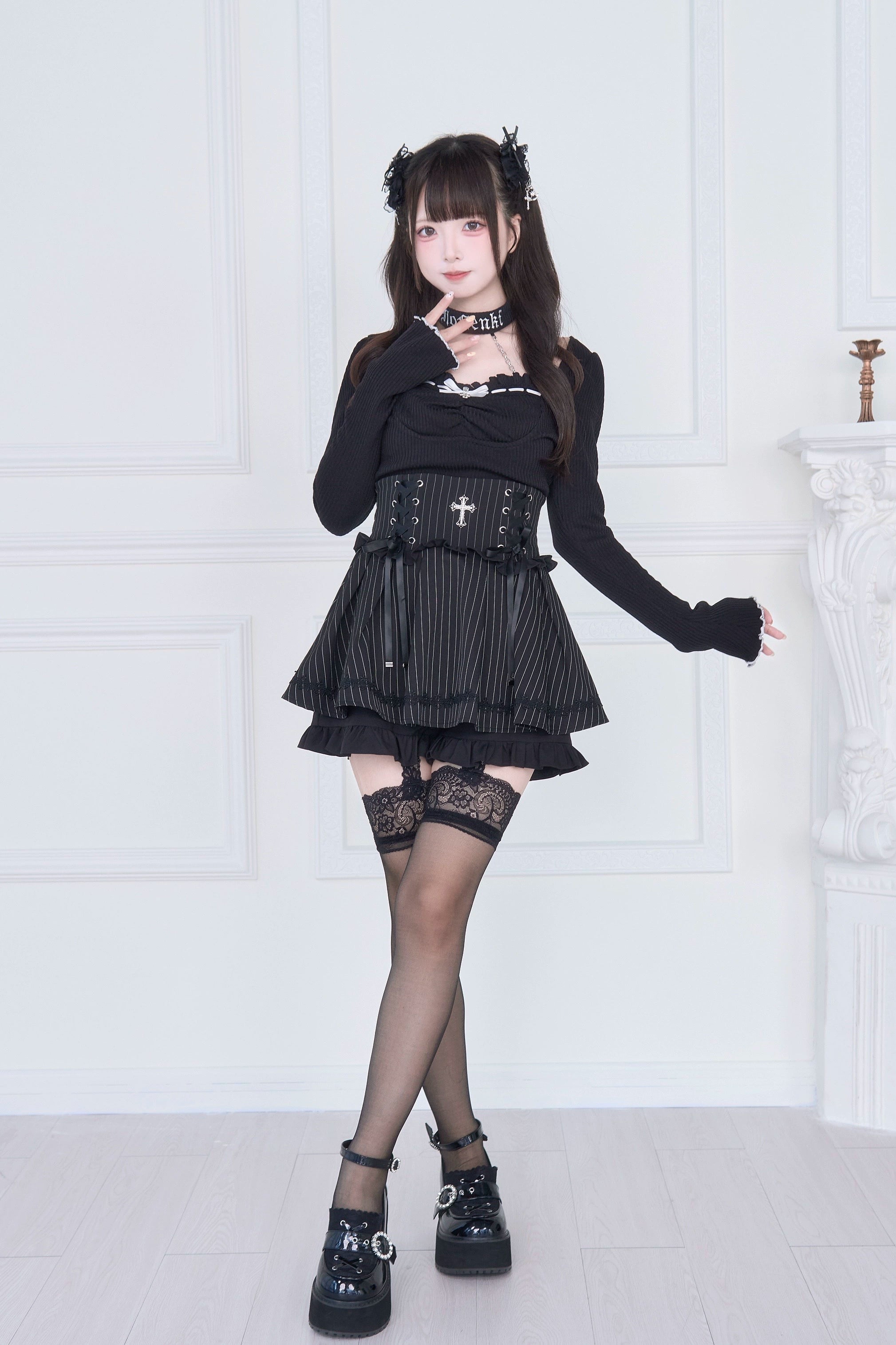 Long sleeve black Jirai Kei top cross corset waistband pinstripe ruffled skirt platform shoes side view