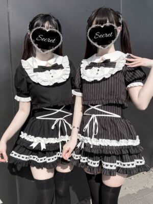 Black and white Jirai Kei maid two-piece set front full-body group shot with models wearing pearl-trimmed collar blouse and tiered ruffled skirt with heart-shaped lace cutouts