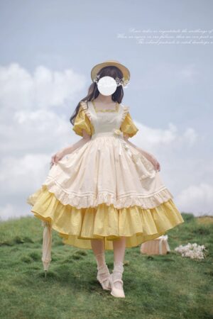 Jirai Kei Lolita OP dress with cream over-skirt, back three-quarter view showing tiered ruffled hem, puff sleeves, and two-tone cream yellow design with lace trim details