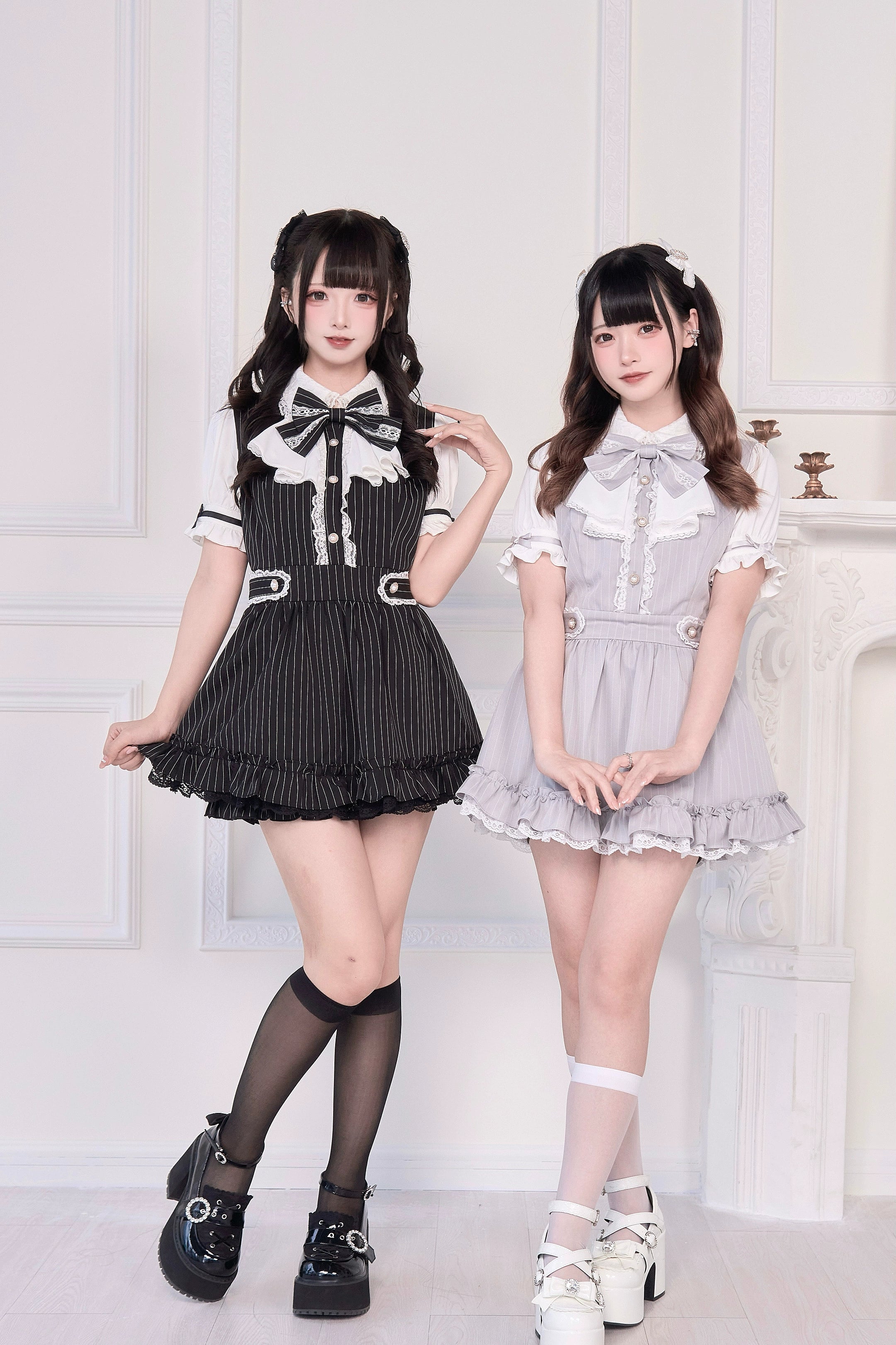Jirai Kei maid dress collection group shot black striped and gray solid variants on models indoor vintage setting