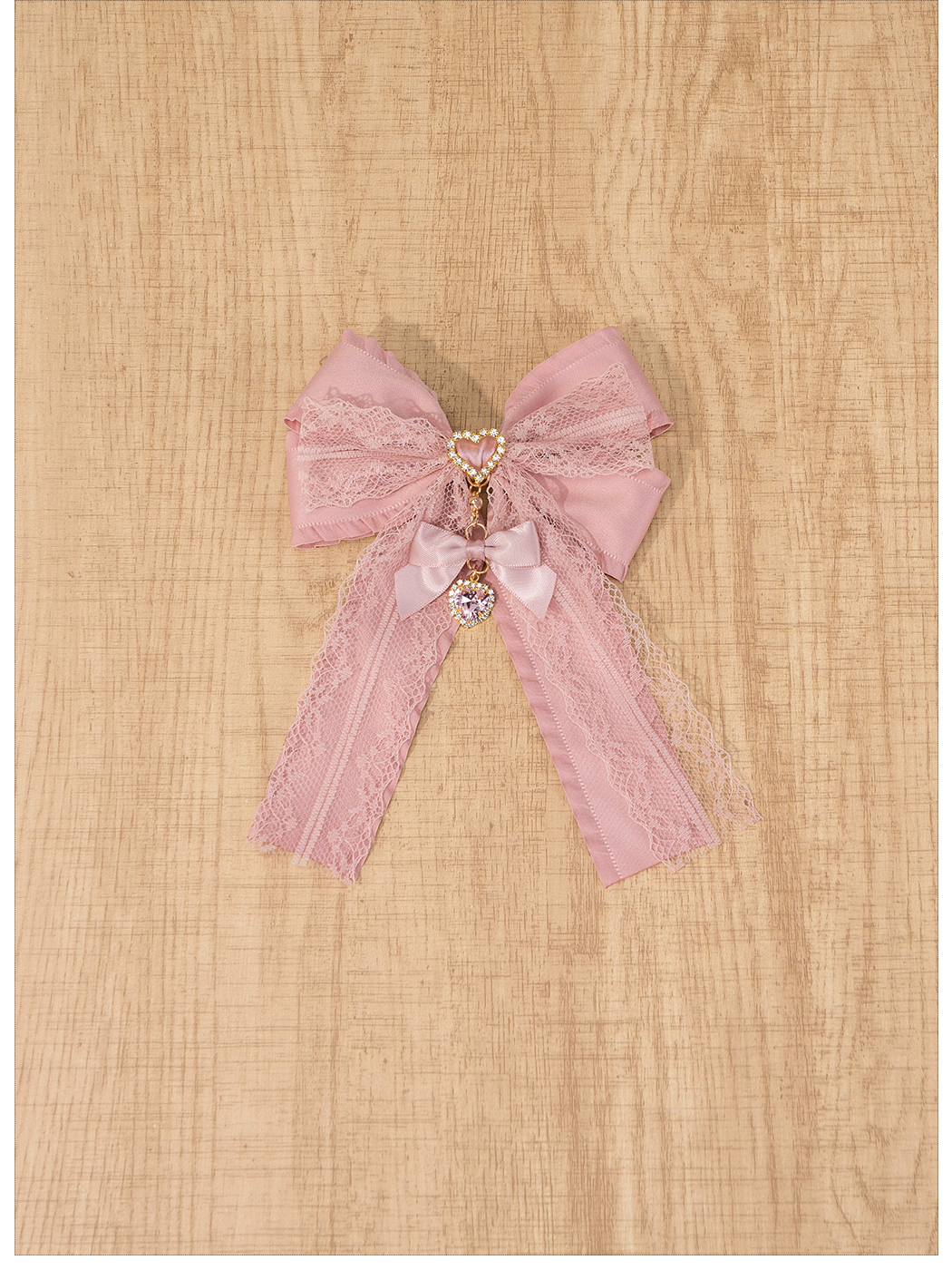 Compact pink satin lace bow brooch pendant detail view showcasing delicate lace texture and satin ribbon construction for Jirai Kei fashion