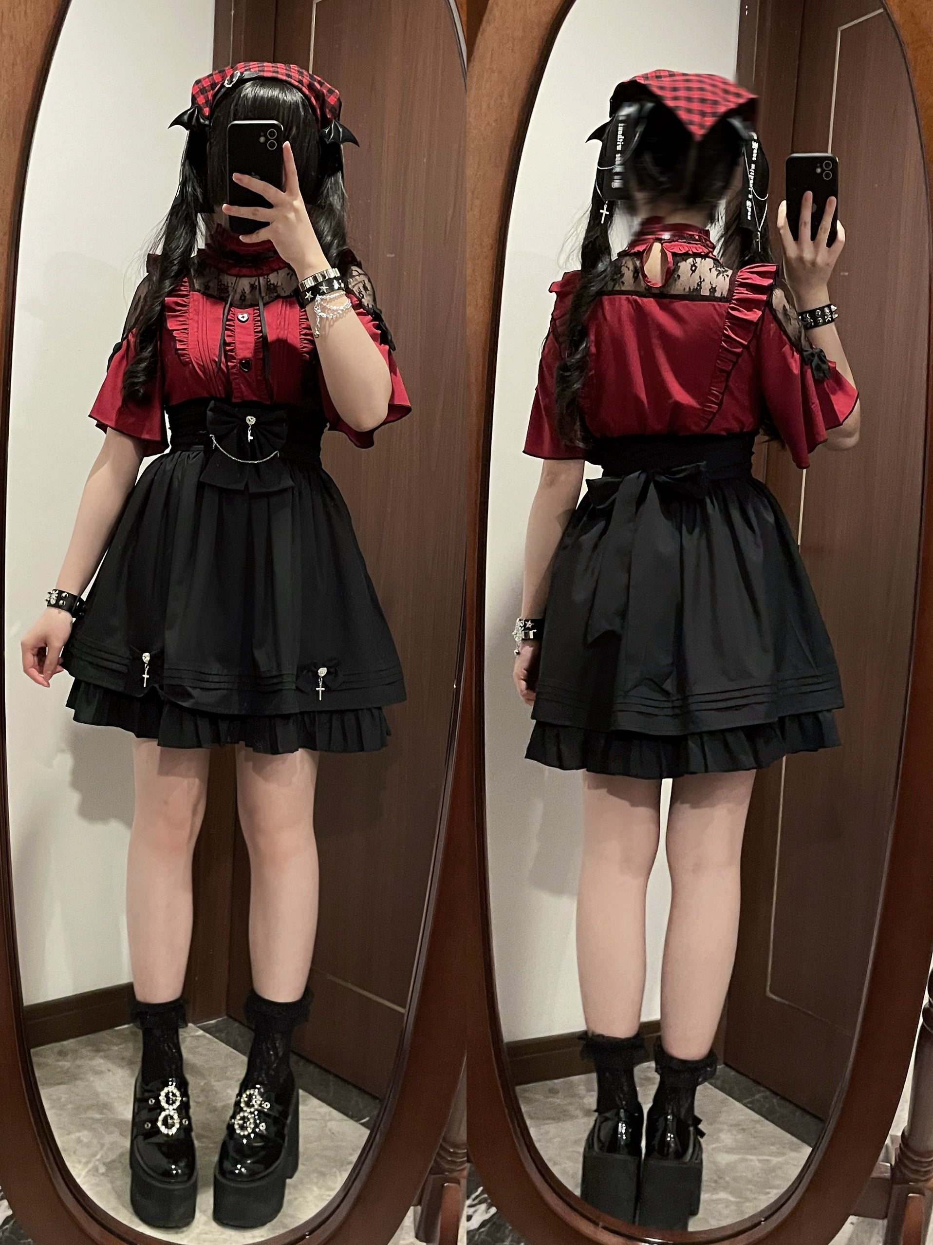 Dual mirror selfie of two female models in matching red and black jirai kei two-piece sets with red short-sleeve ruffled blouse, black high-waist skirt, platform boots and cross decoration