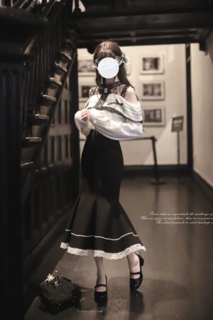 Off-shoulder blouse mermaid skirt set three-quarter side view fishtail silhouette high-waisted vintage hallway backdrop