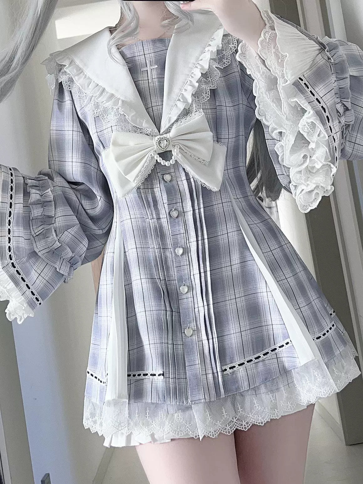 Gray Jirai Kei hime puff sleeve dress with heart-shaped buttons and removable bow tie paired with pocketed shorts, front view featuring lace-up back corset styling and gothic aesthetic
