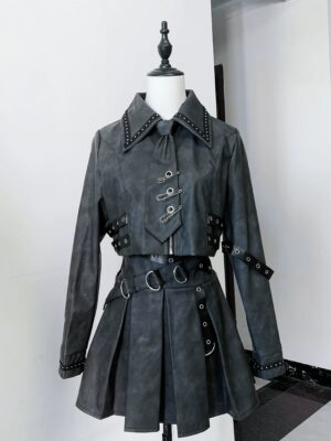 Jirai Kei distressed PU leather jacket and pleated skirt set front view on dress form showing studded details and removable bow tie