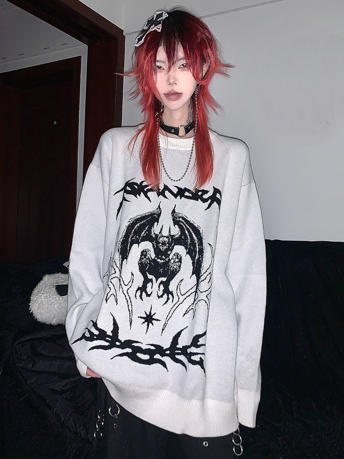 White bat printed sweater full product shot showing relaxed fit crew neckline and embroidery graphic placement
