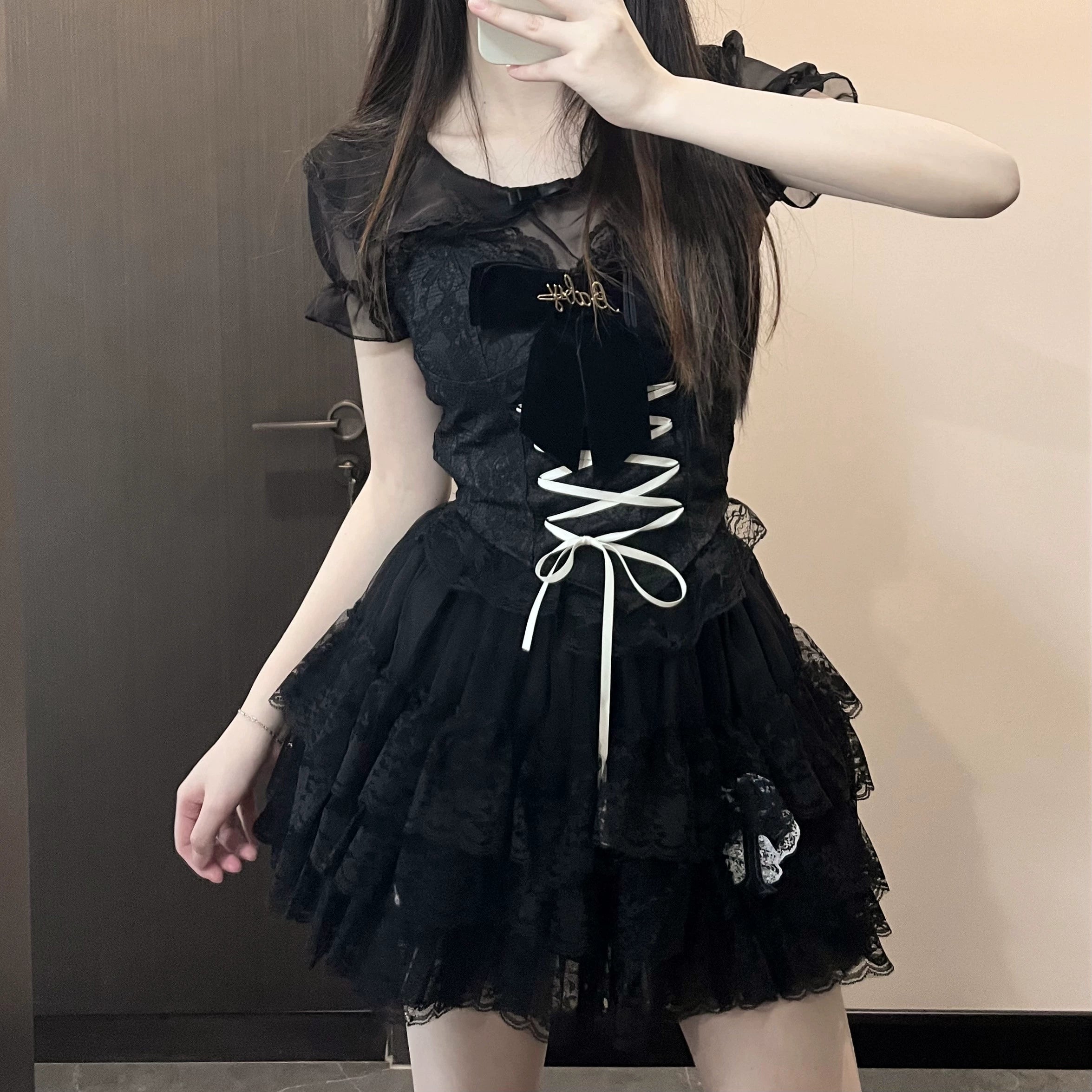 Jirai Kei black gothic lace set front mirror selfie with simple round neck sheer lace top and white corset lacing layered ruffle skirt
