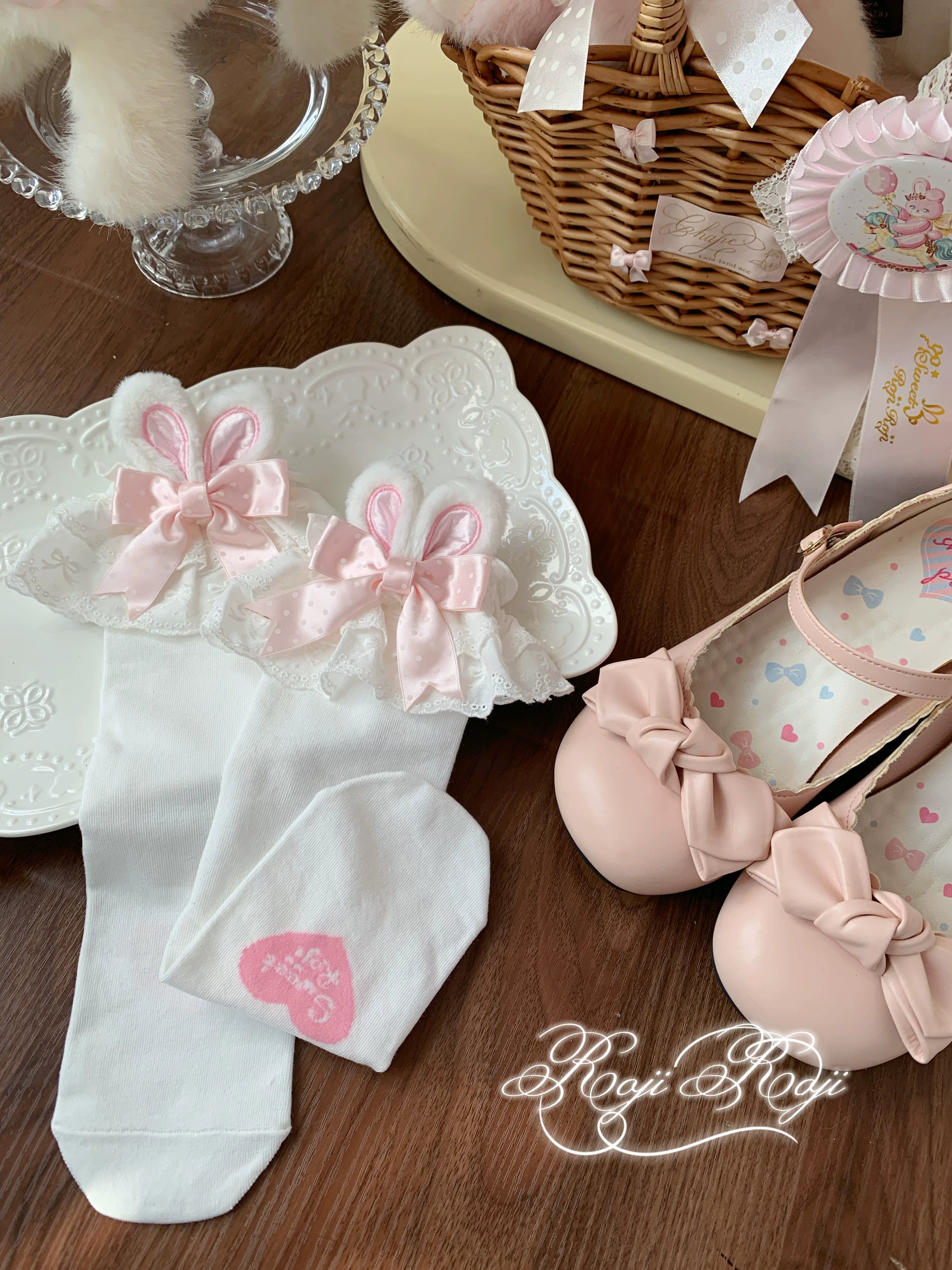 Jirai Kei light blue polka dot bunny ear socks with white base worn with blue flat shoes and light blue polka dot Lolita skirt in specialty shop setting