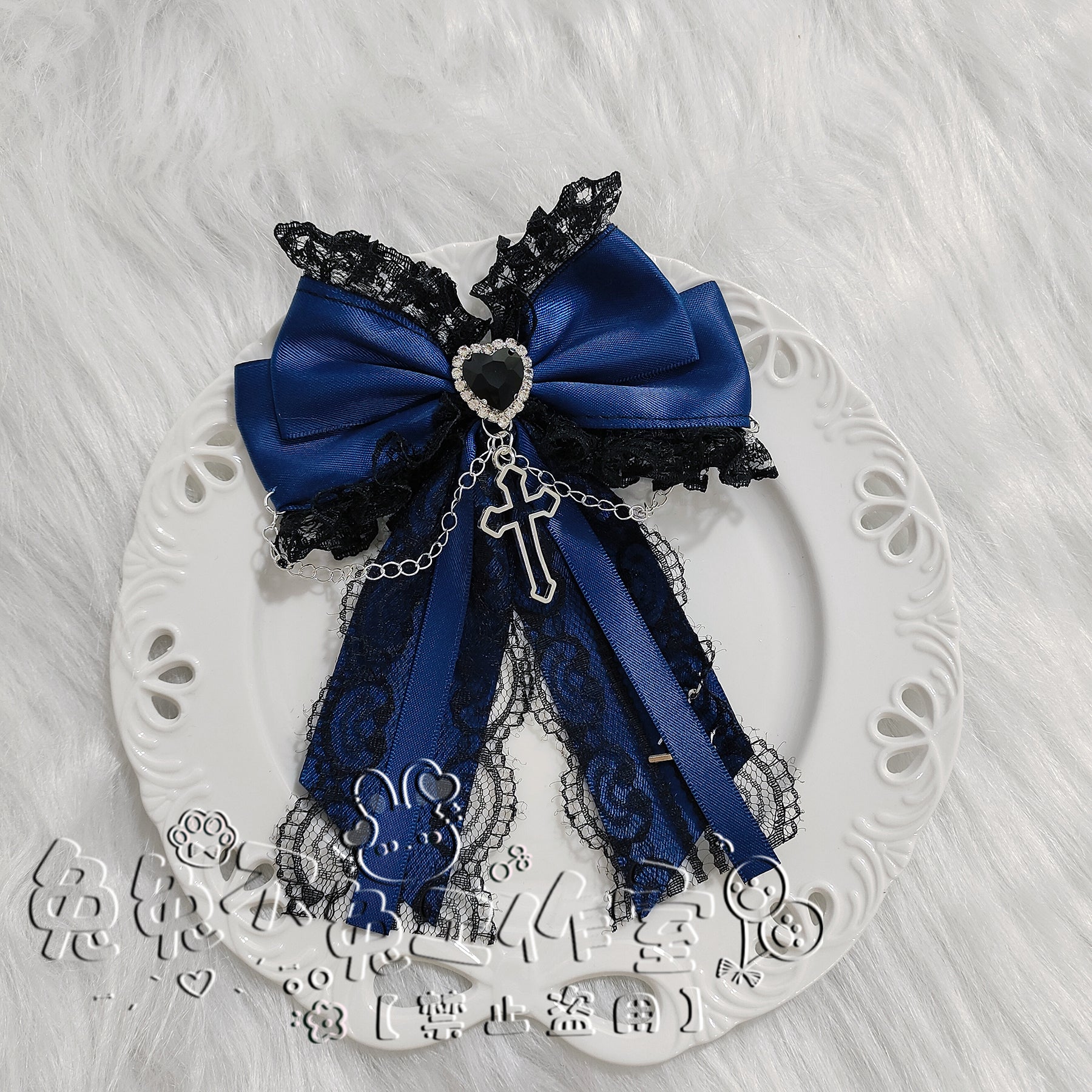 Dark blue satin bow hair clip with lace detailing, silver cross pendant chain and heart rhinestone accent for Jirai Kei fashion coordination