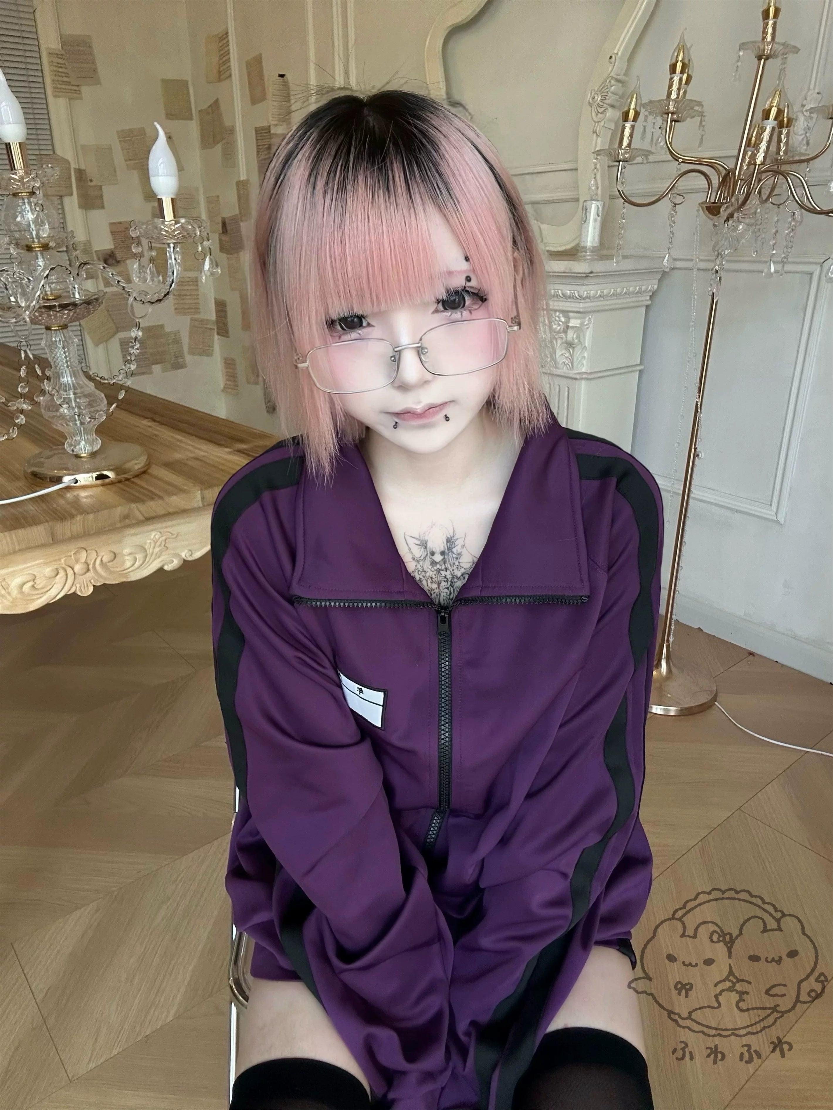 purple jirai kei zip-up track jacket black stripes seated model vintage indoor setting