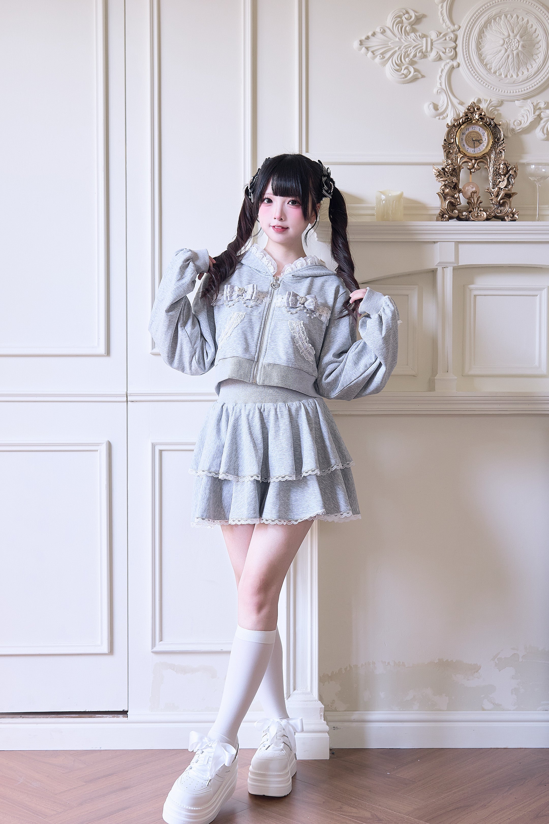 Gray Jirai Kei sport hoodie and layered mini skirt side profile view hand on shoulder showing double-layer ruffle hem