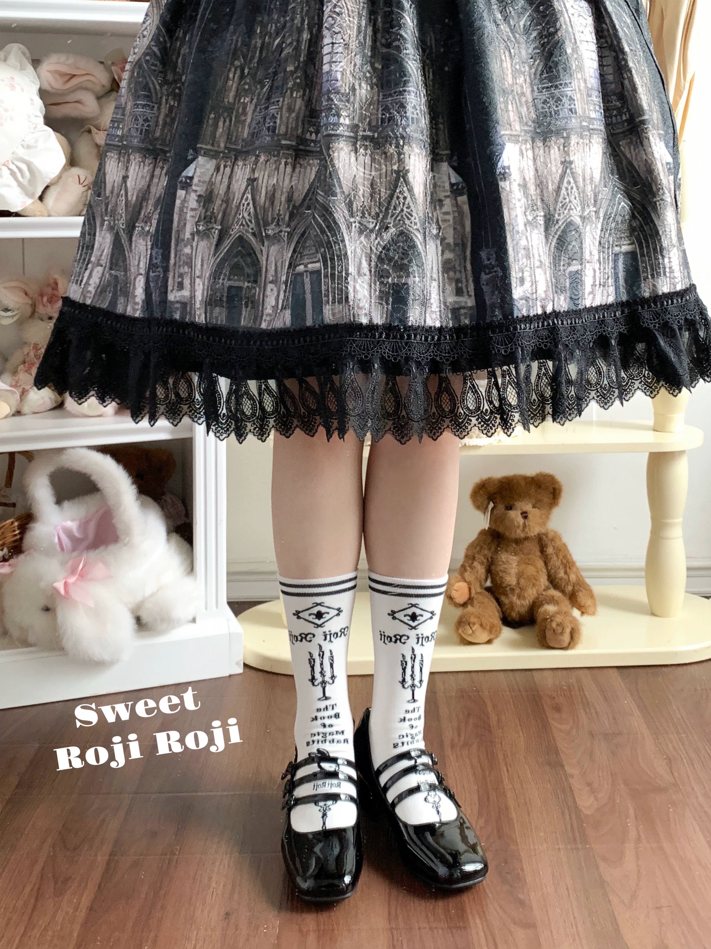 Jirai Kei white mid-calf socks with black vintage prints worn with cathedral print skirt and leather Mary Jane shoes