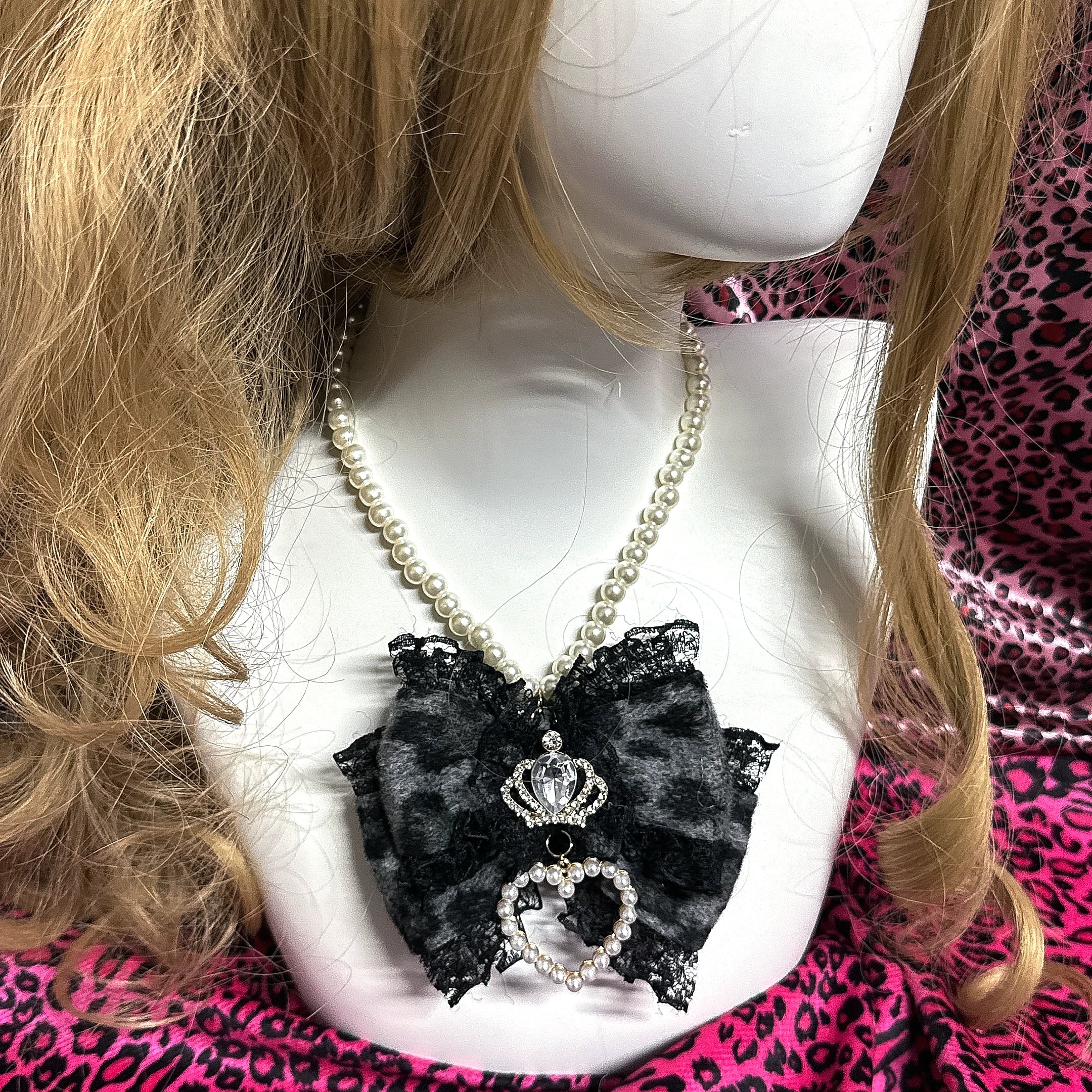 Grey leopard leopard bow pearl choker necklace with crown rhinestone pearl heart and black lace edging front view