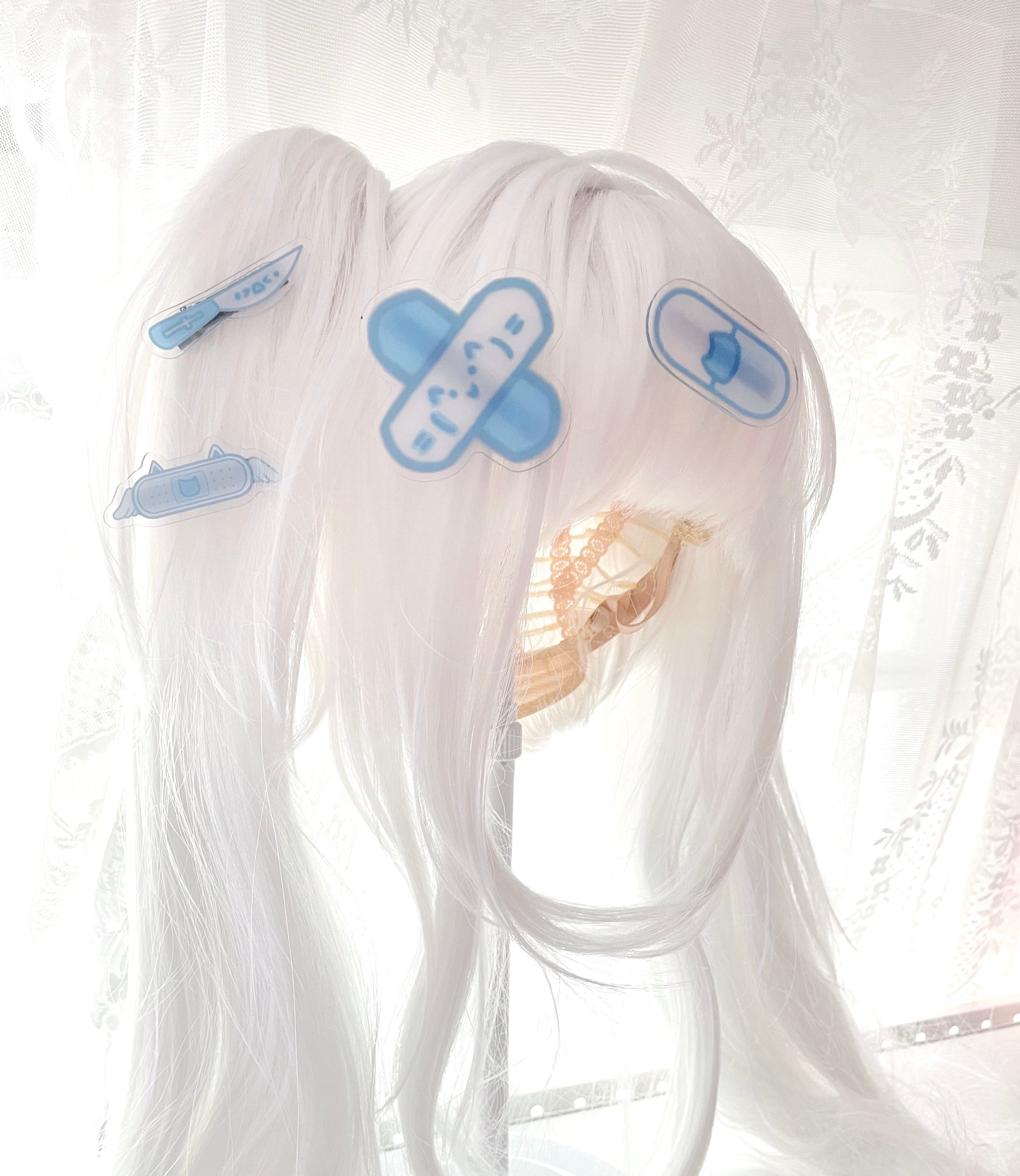 Tenshi Kaiwai Jirai Kei hair clips worn on white twin tail wig styled with light blue coordinated acrylic clip designs