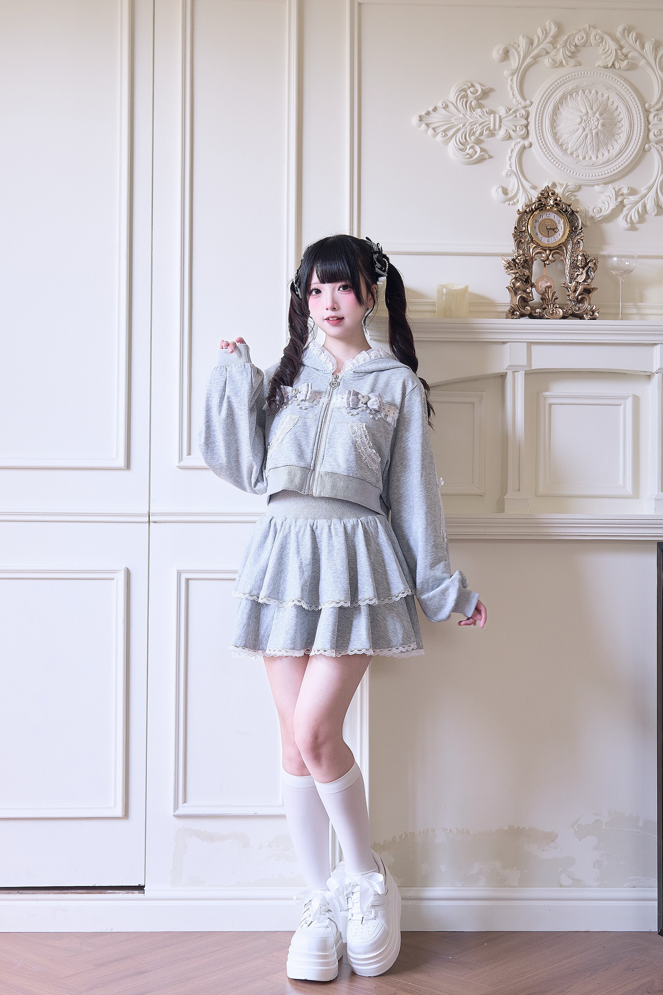Gray Jirai Kei lace hoodie coat with mini tiered ruffle skirt three-quarter shot raised hand pose showing lace trim details