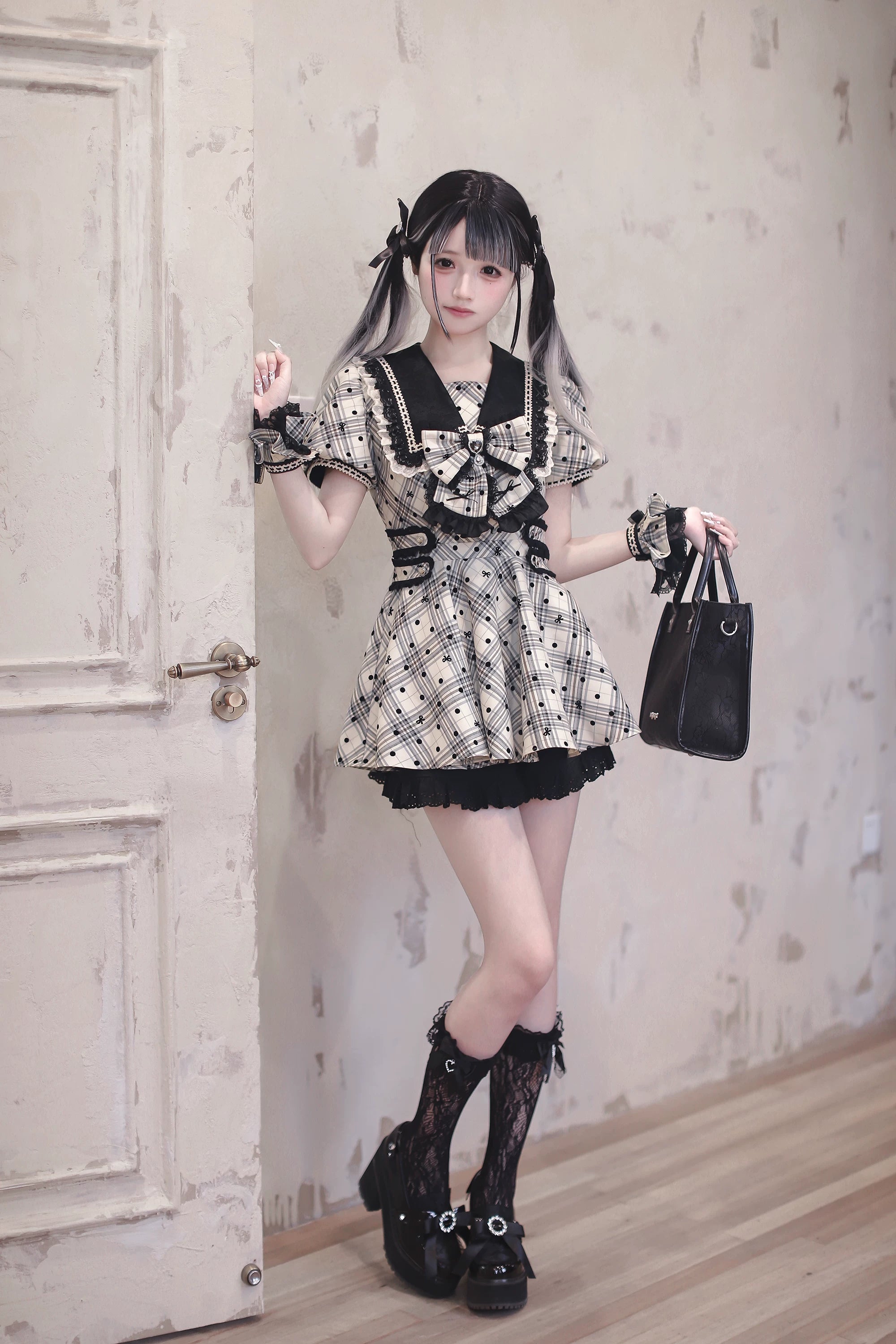 Flat lay styling display of complete Jirai Kei plaid polka dot dress ensemble with all coordinating accessories arranged on surface