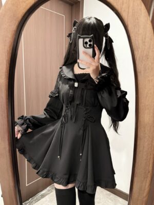 Jirai Kei three-piece outfit set including black dress shorts and rhinestone bow tie modeled with platform shoes