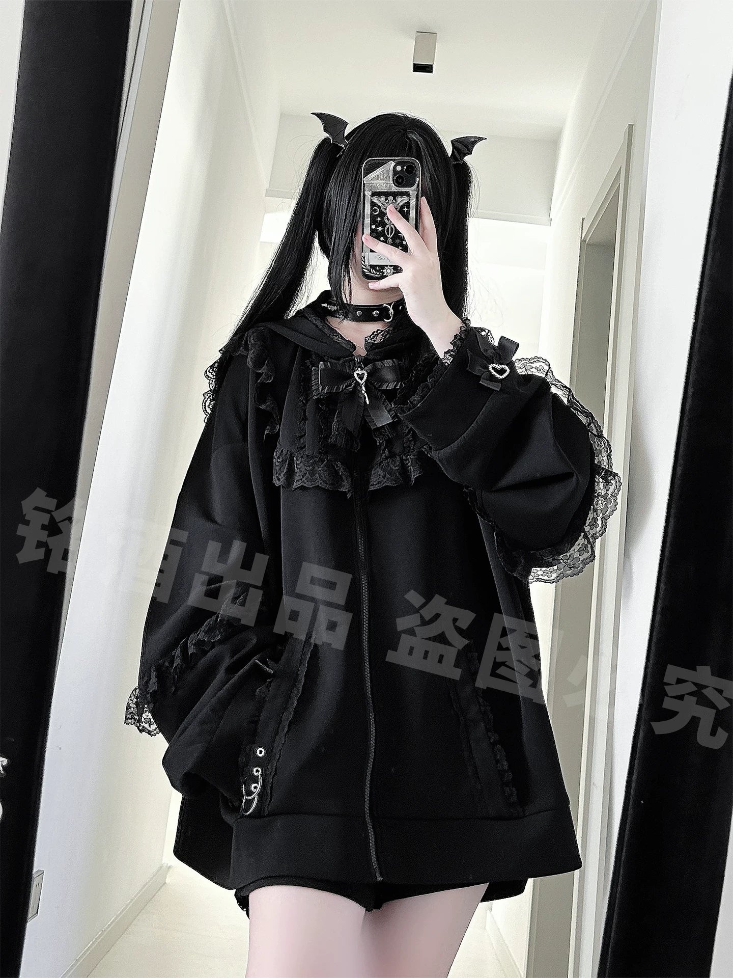 Black lace-trimmed oversized zip-up Jirai Kei hoodie with large lace collar, metal ring zipper pockets, and loose fit, half-body front mirror selfie with devil tail styling