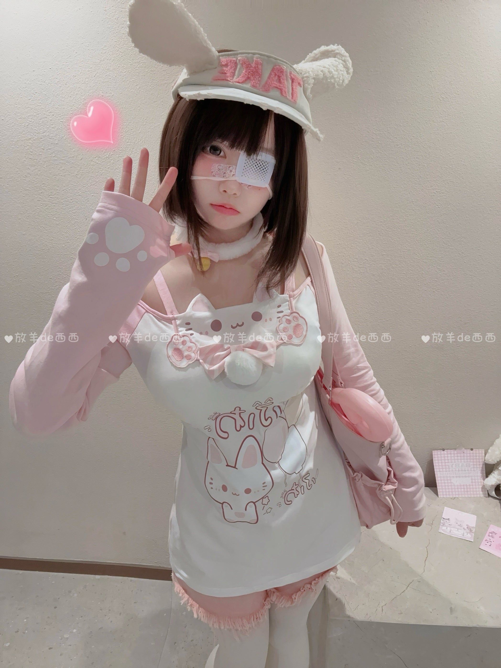 Cute Jirai Kei cat-print outfit set with paw-print fingerless gloves and crossbody pink animal-themed bag, front half-body indoor shot featuring bunny-ear hair accessory and eye patch aesthetic styling