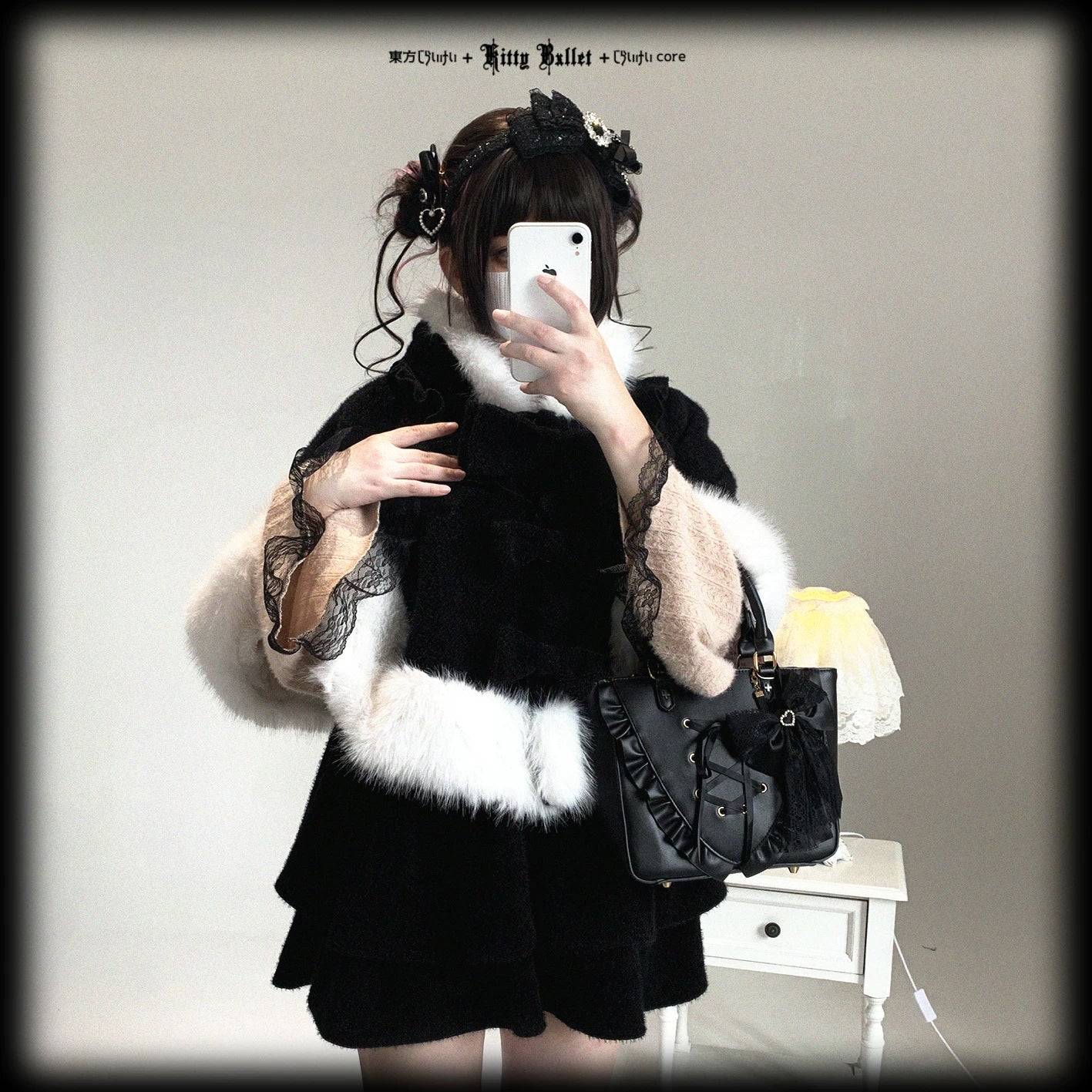 Black and white cat-ear hooded cape full product view with white fuzzy trim, showcasing monochrome Jirai Kei aesthetic and premium construction