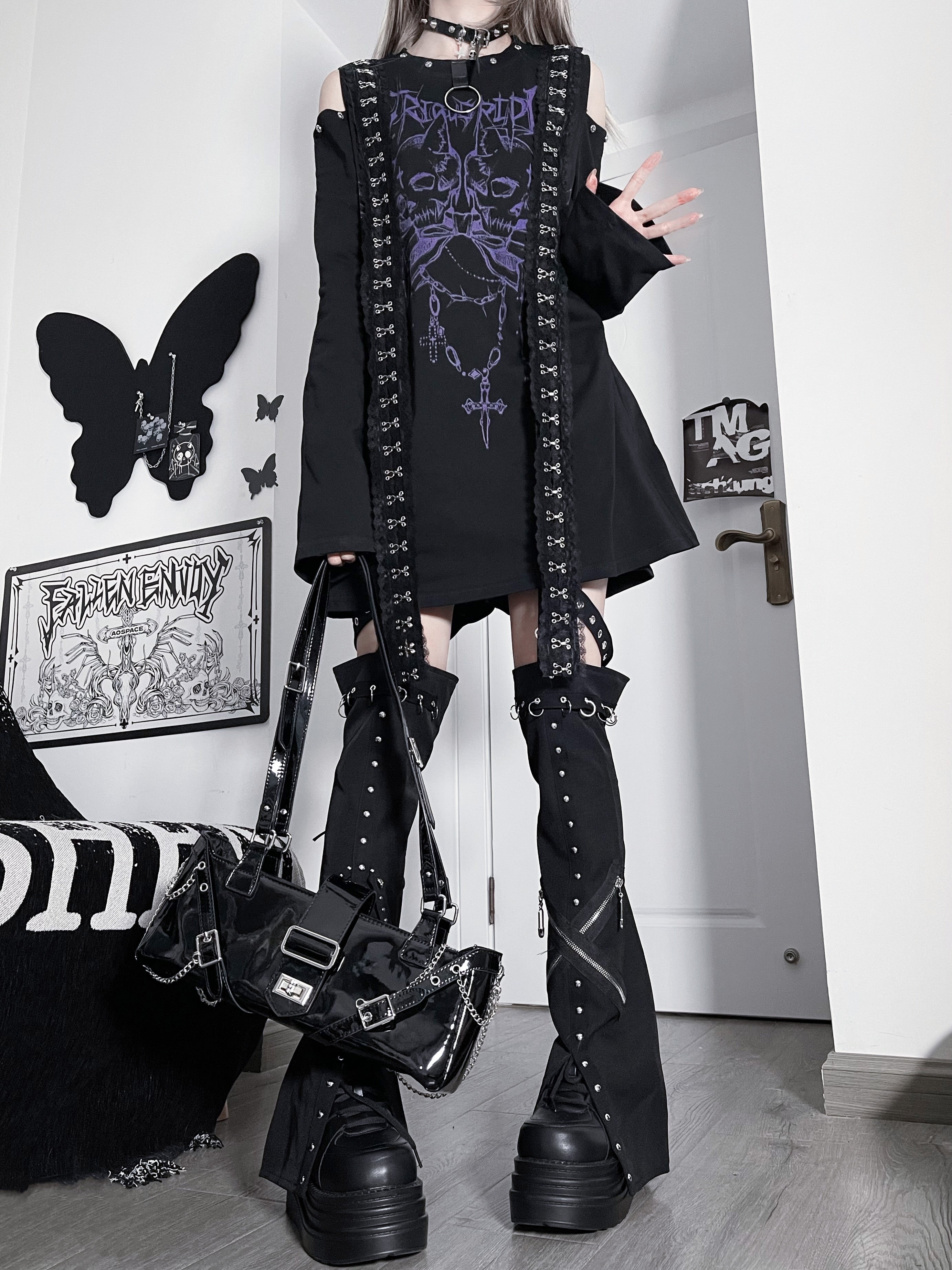 Black-white jirai kei oversized cold-shoulder t-shirt with skull and cross print styling angle