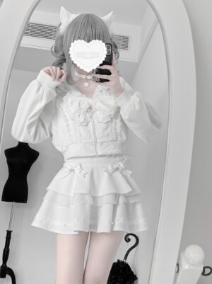 White Jirai Kei hoodie and tiered ruffle skirt set worn on model with cat ear hairpin and heart-blurred face, full-length mirror selfie view showcasing puffed long sleeves and layered mini skirt