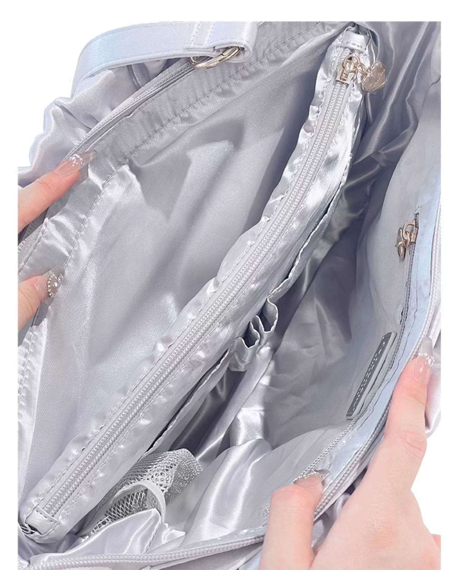 Jirai Kei itabag collection lineup multiple colors arranged flat lay including black white wine red navy blue silver variants