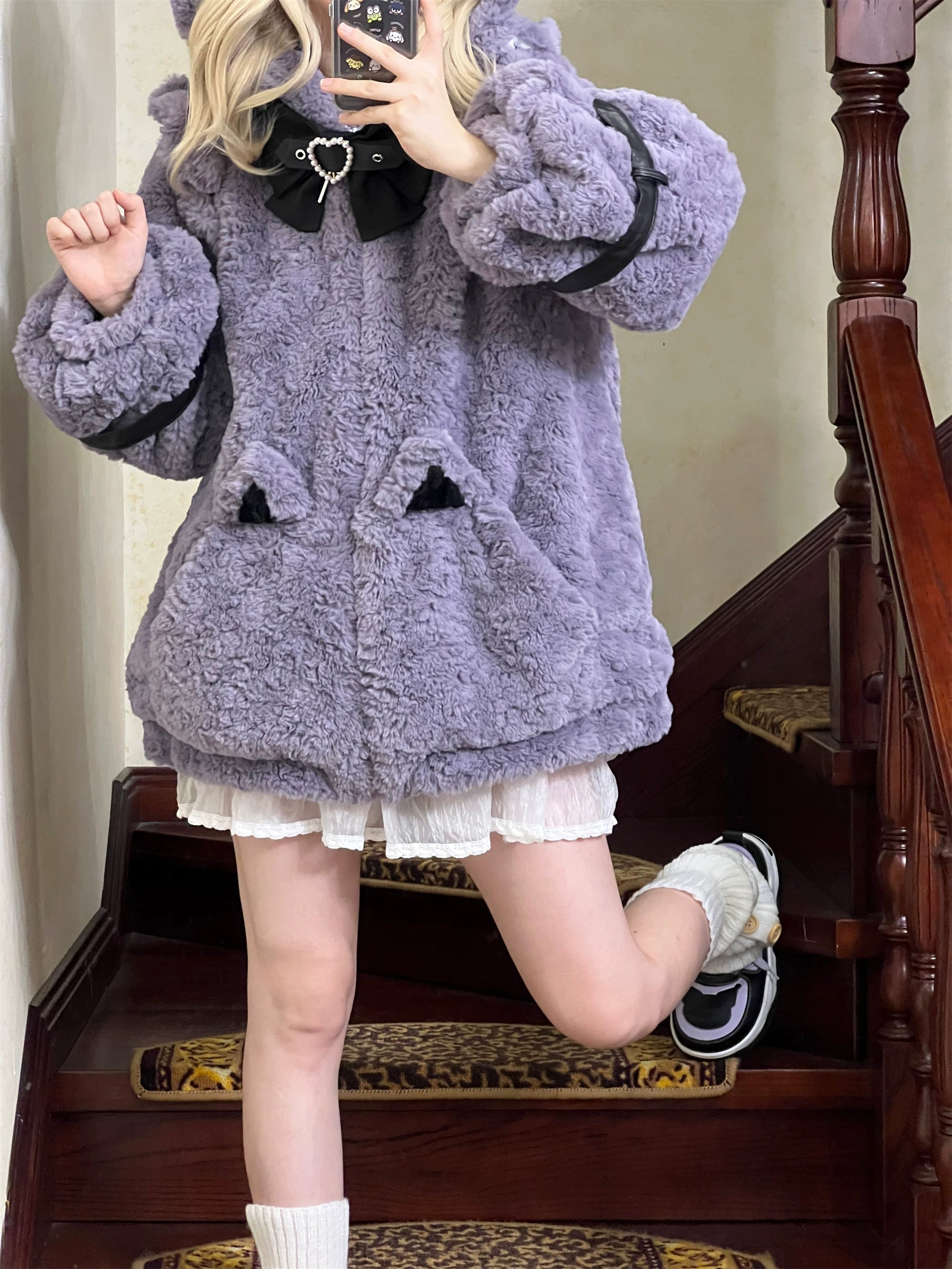 Jirai Kei coat front zipper closure detail, smooth operation, metal slider, and full-length zipper track with heart bow positioned at neckline