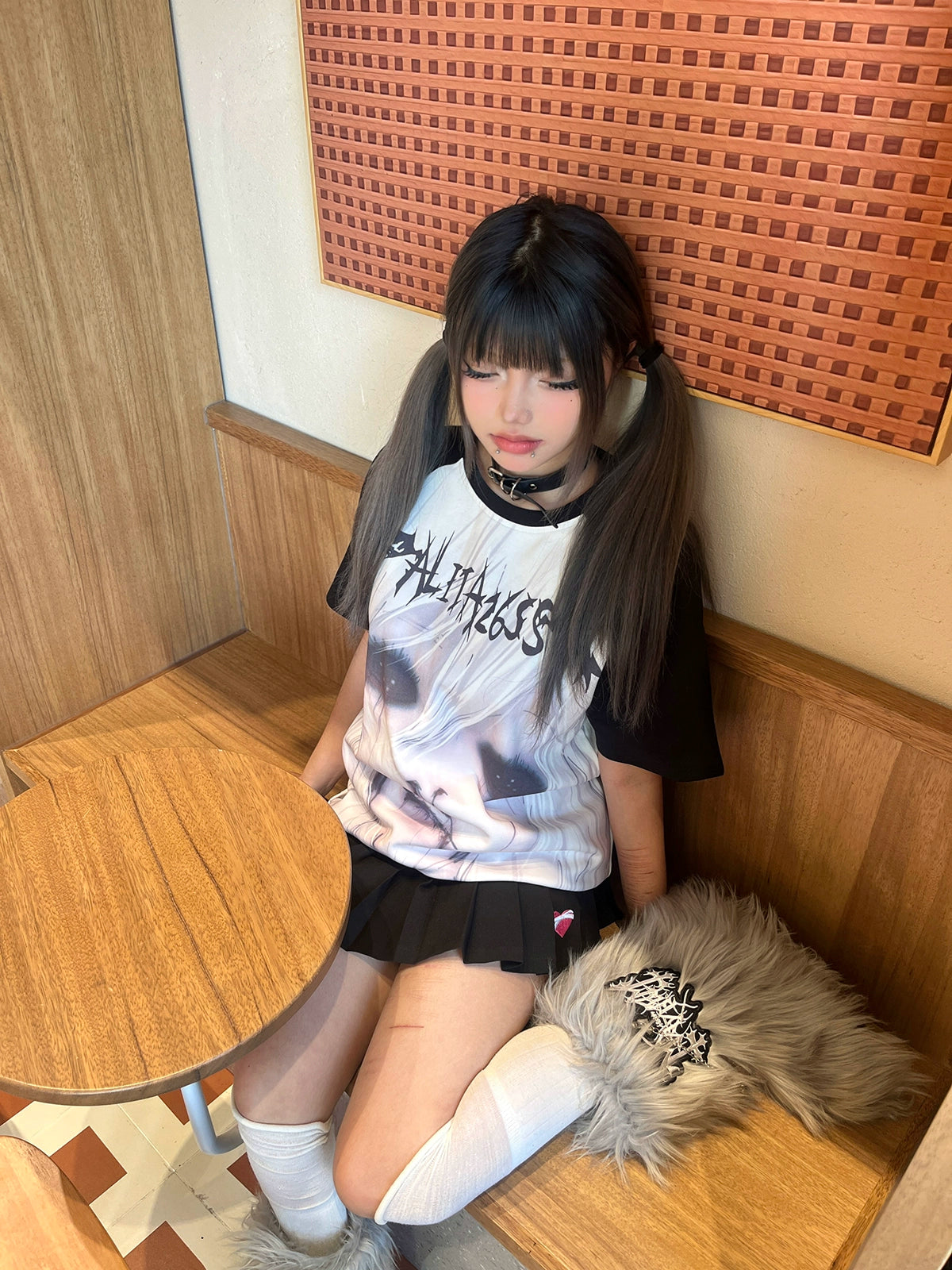 Jirai Kei gothic anime graphic T-shirt with raglan sleeves and red accent tones on model wearing alternative fashion styling
